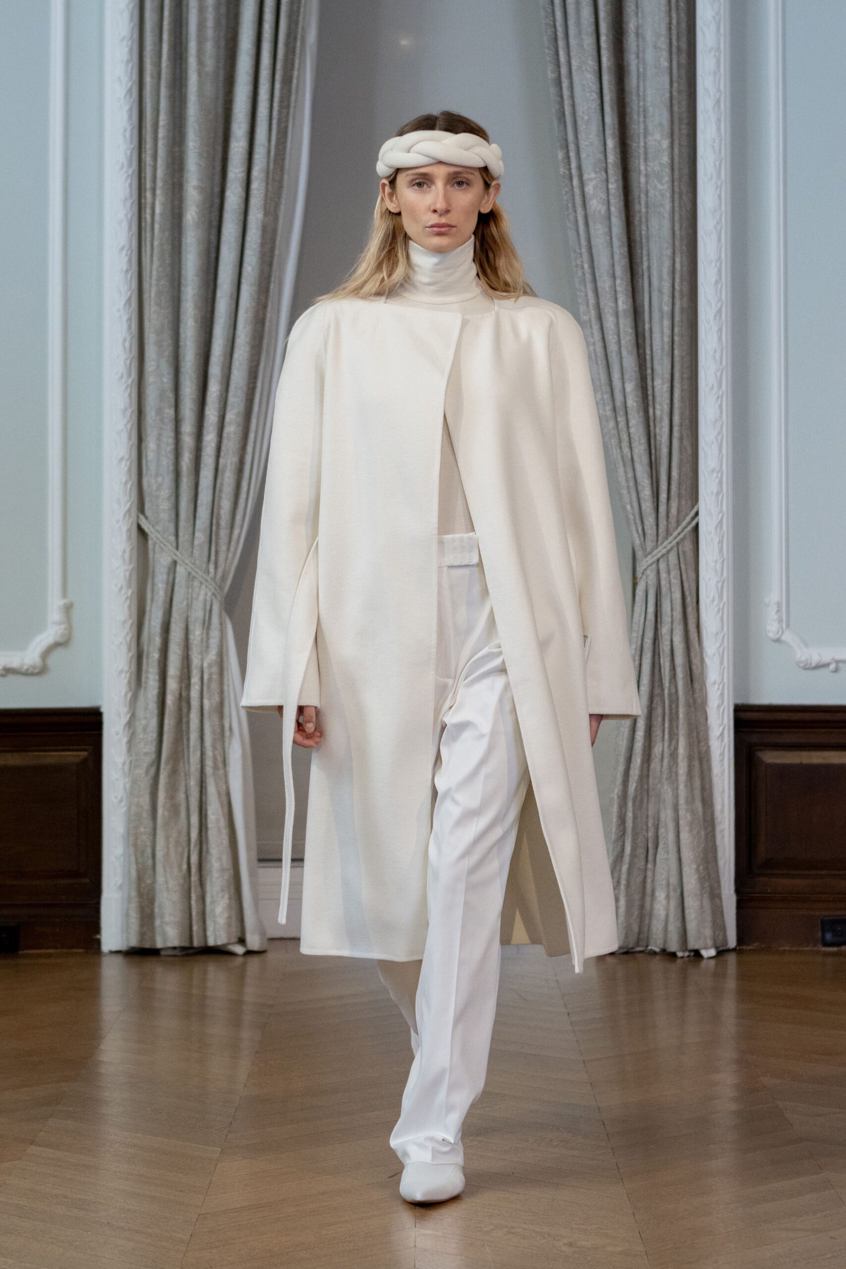 white cape and tailored outfit