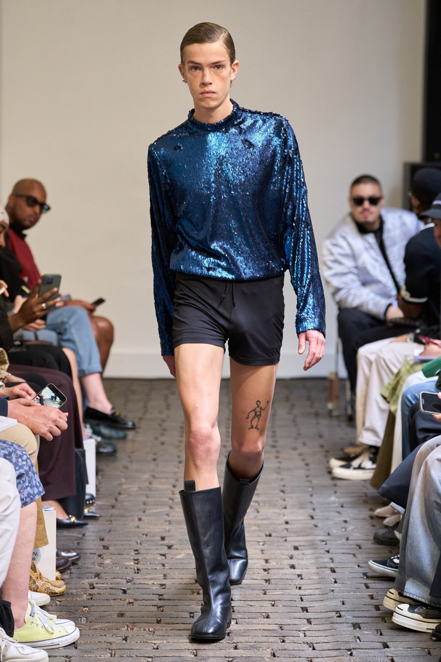 blue sequin top with black shorts
