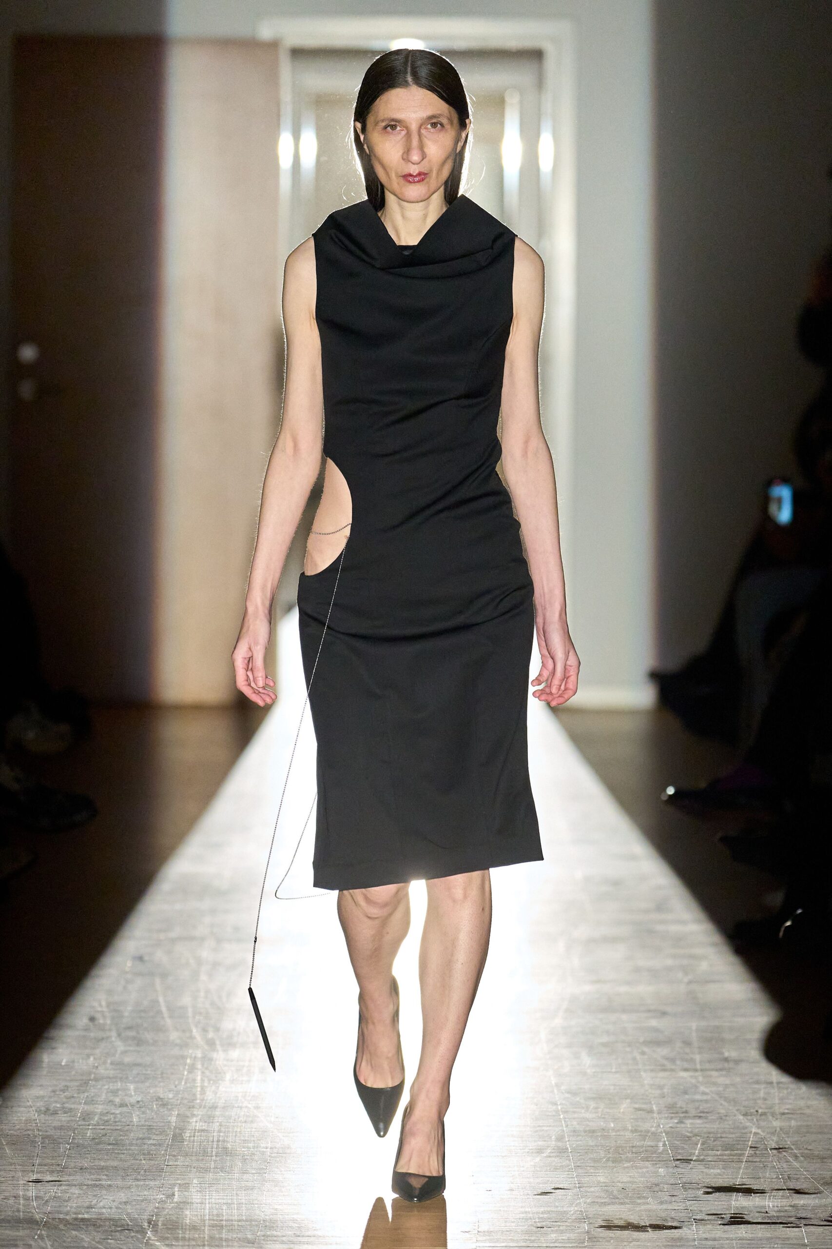 black fitted sleeveless dress with heels