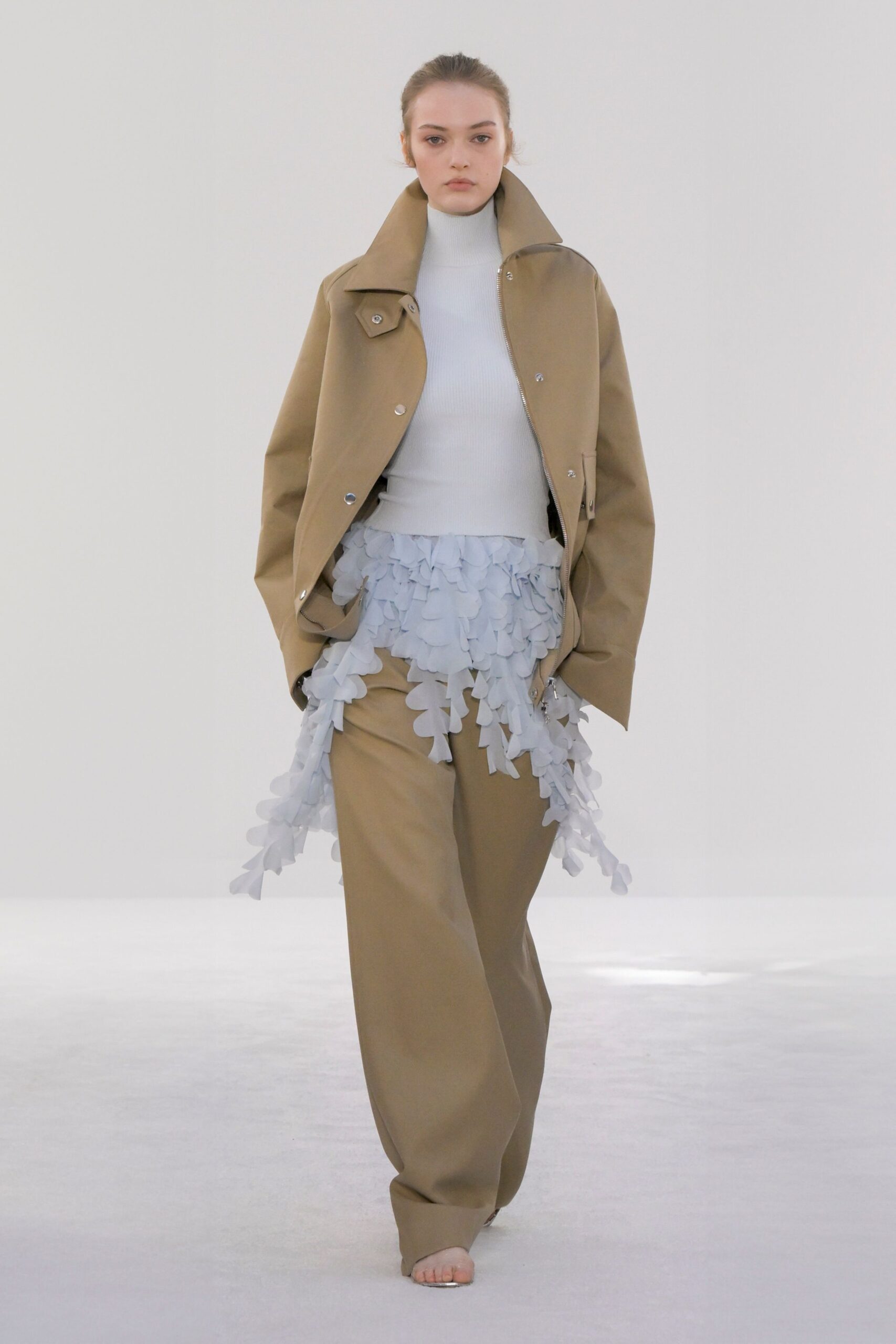 beige jacket white top beige pants