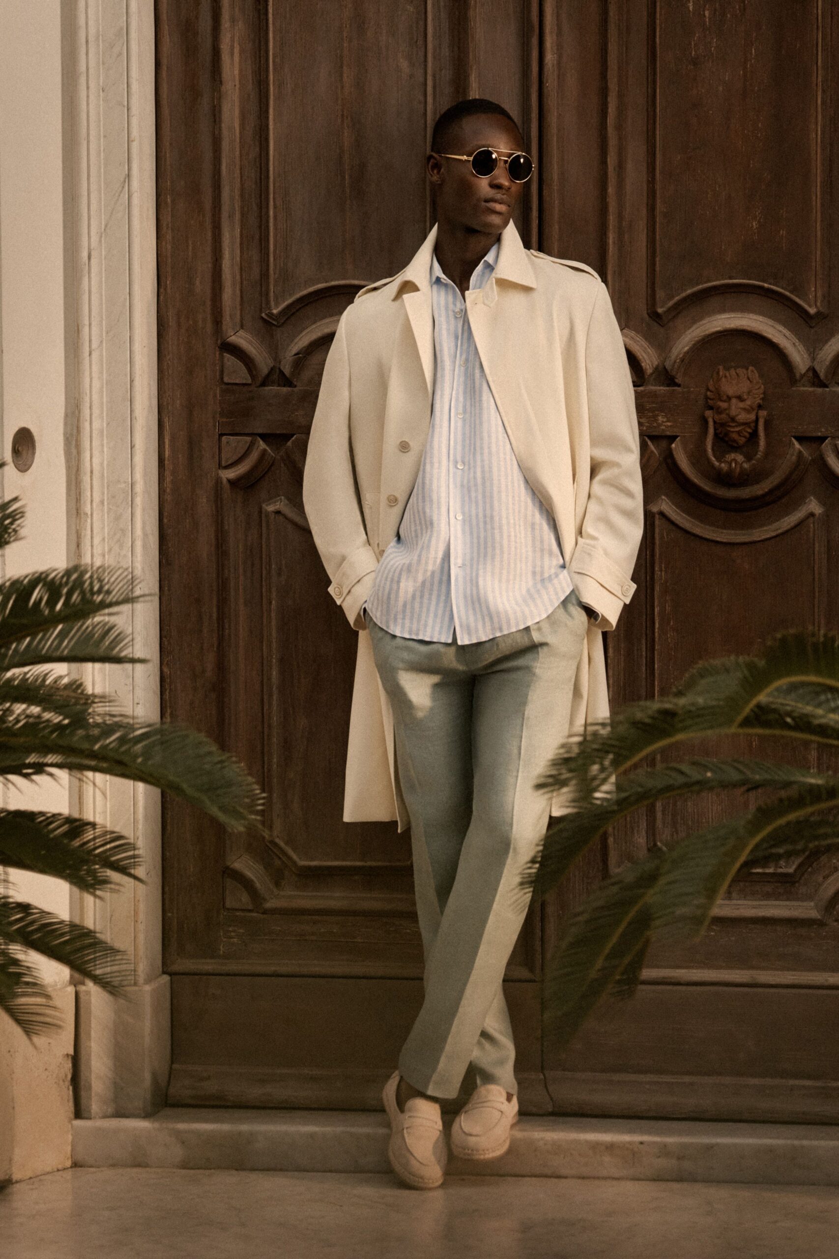 beige wool coat with striped shirt