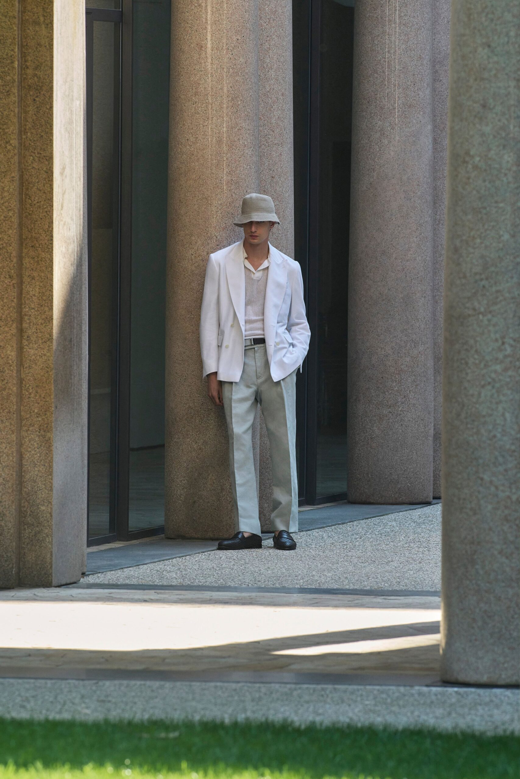 white blazer with beige pants
