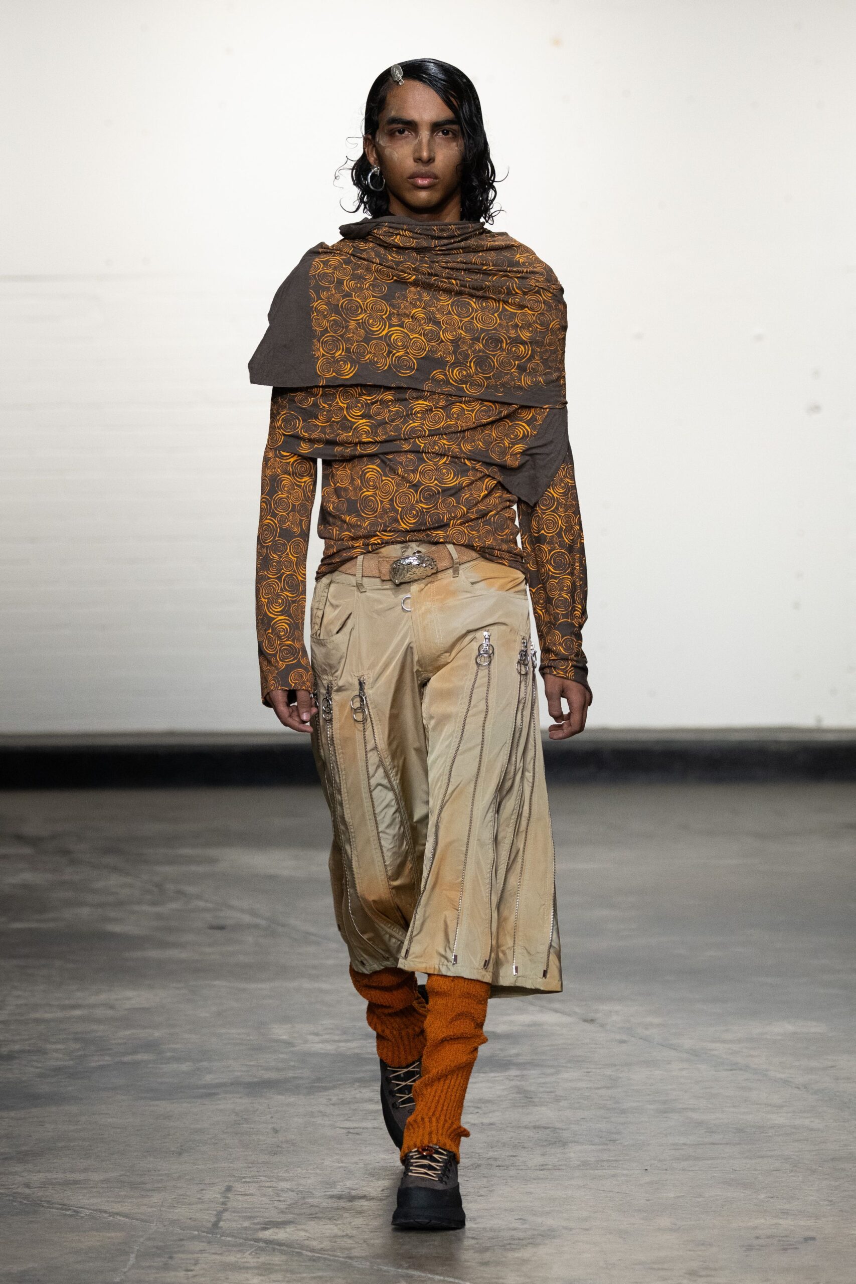 brown printed long-sleeve top with beige pants