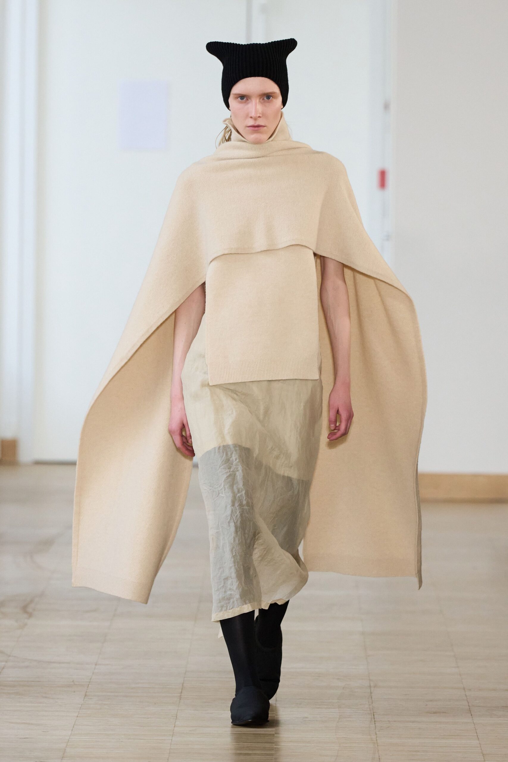 beige wool cape with gray skirt
