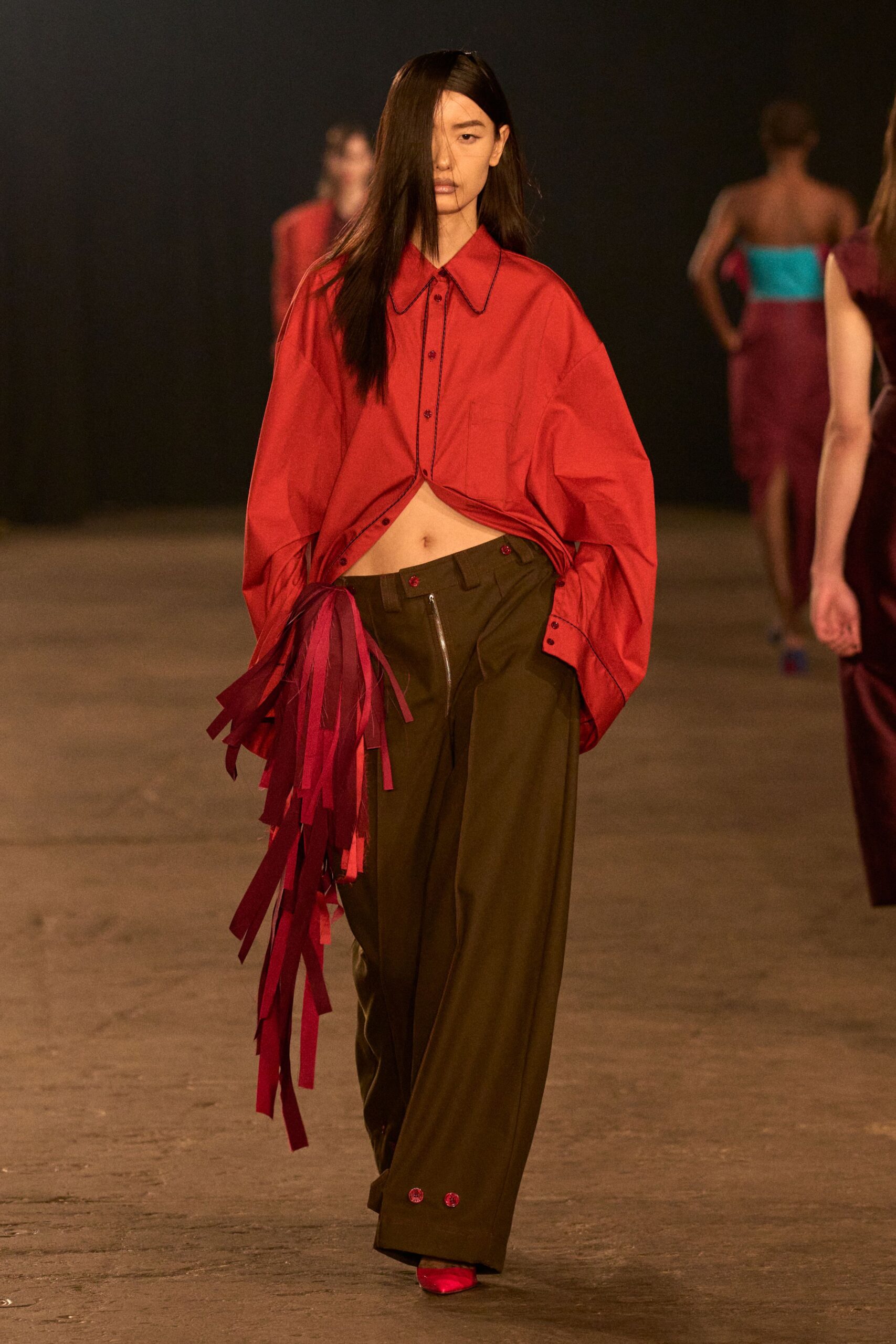 oversized red shirt with relaxed brown pants