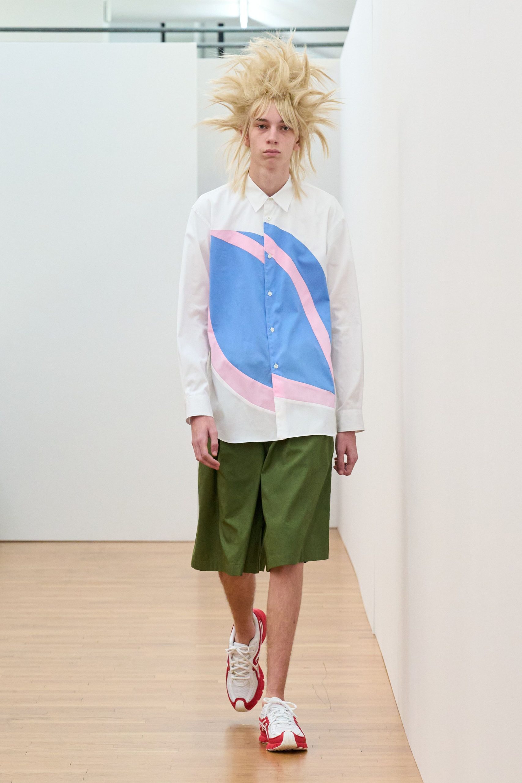 color-blocked shirt with green shorts