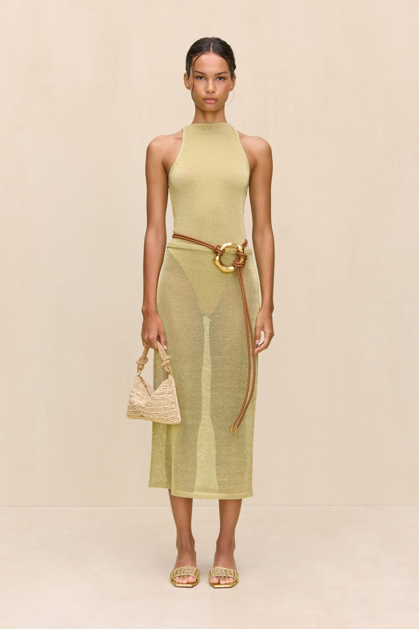 yellow fitted midi dress with accessories