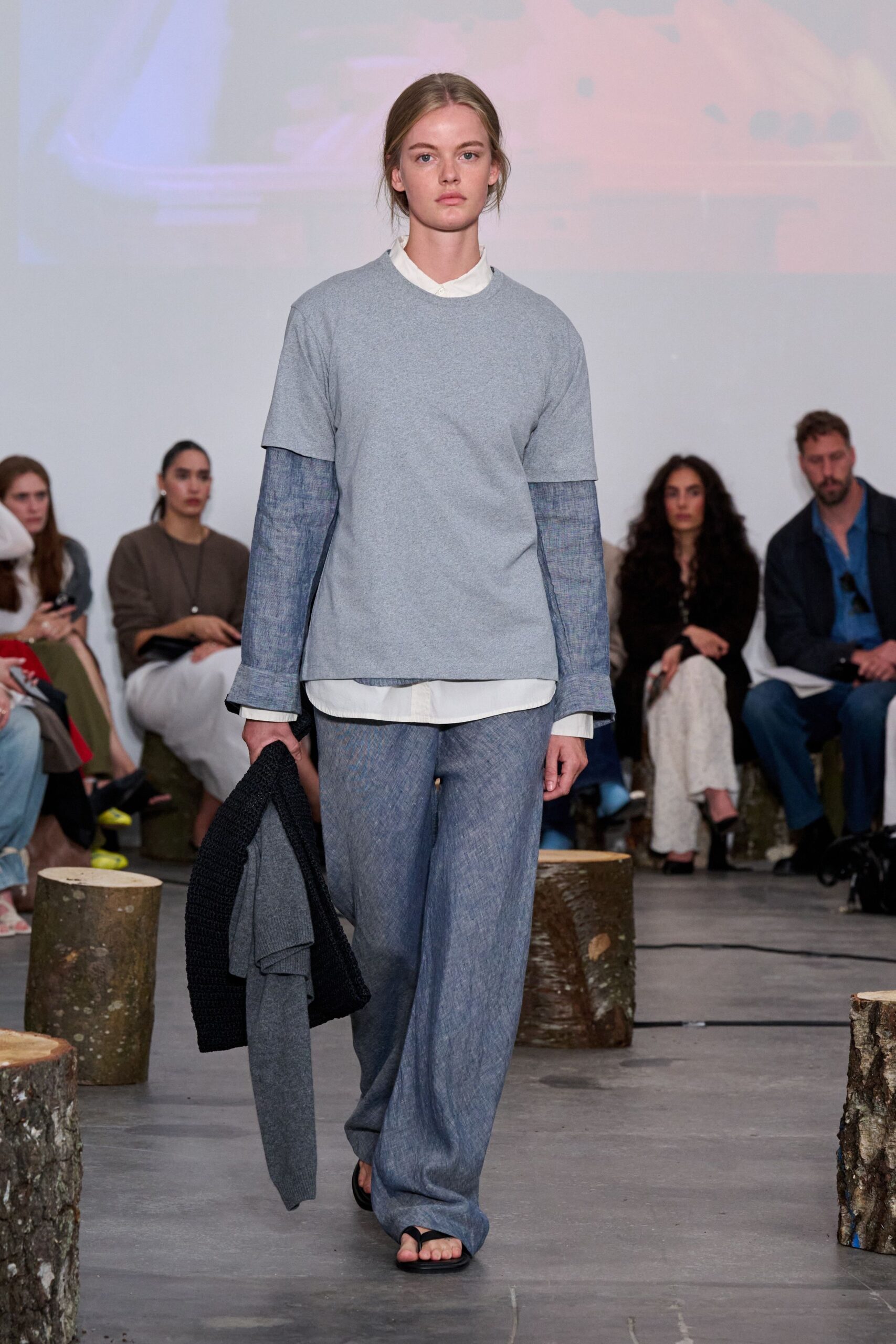 gray relaxed top with blue pants
