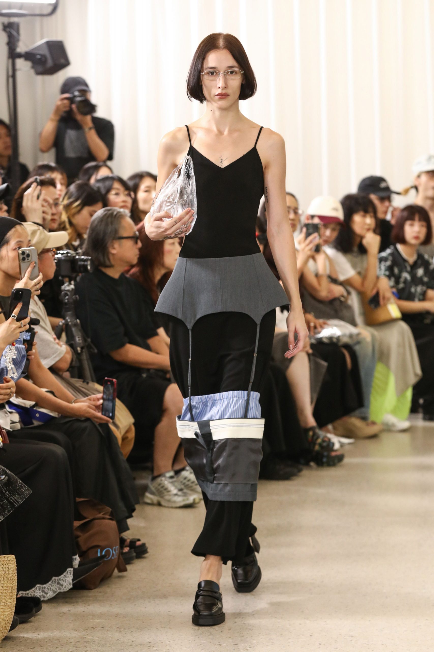 black fitted top with gray pants