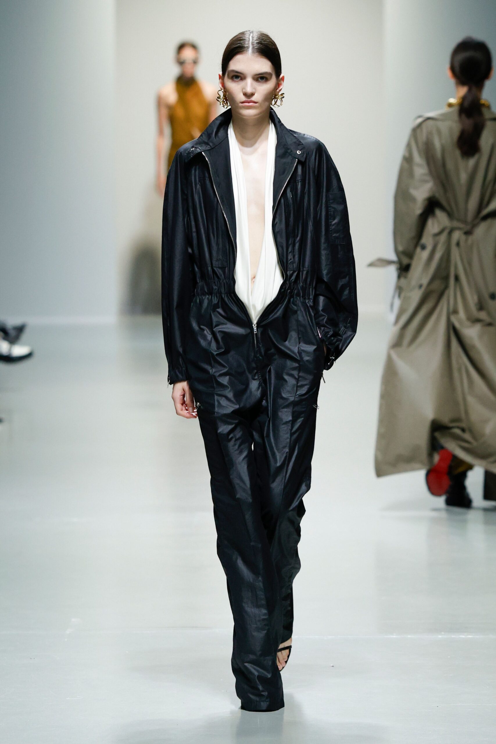 black vinyl jumpsuit with white top