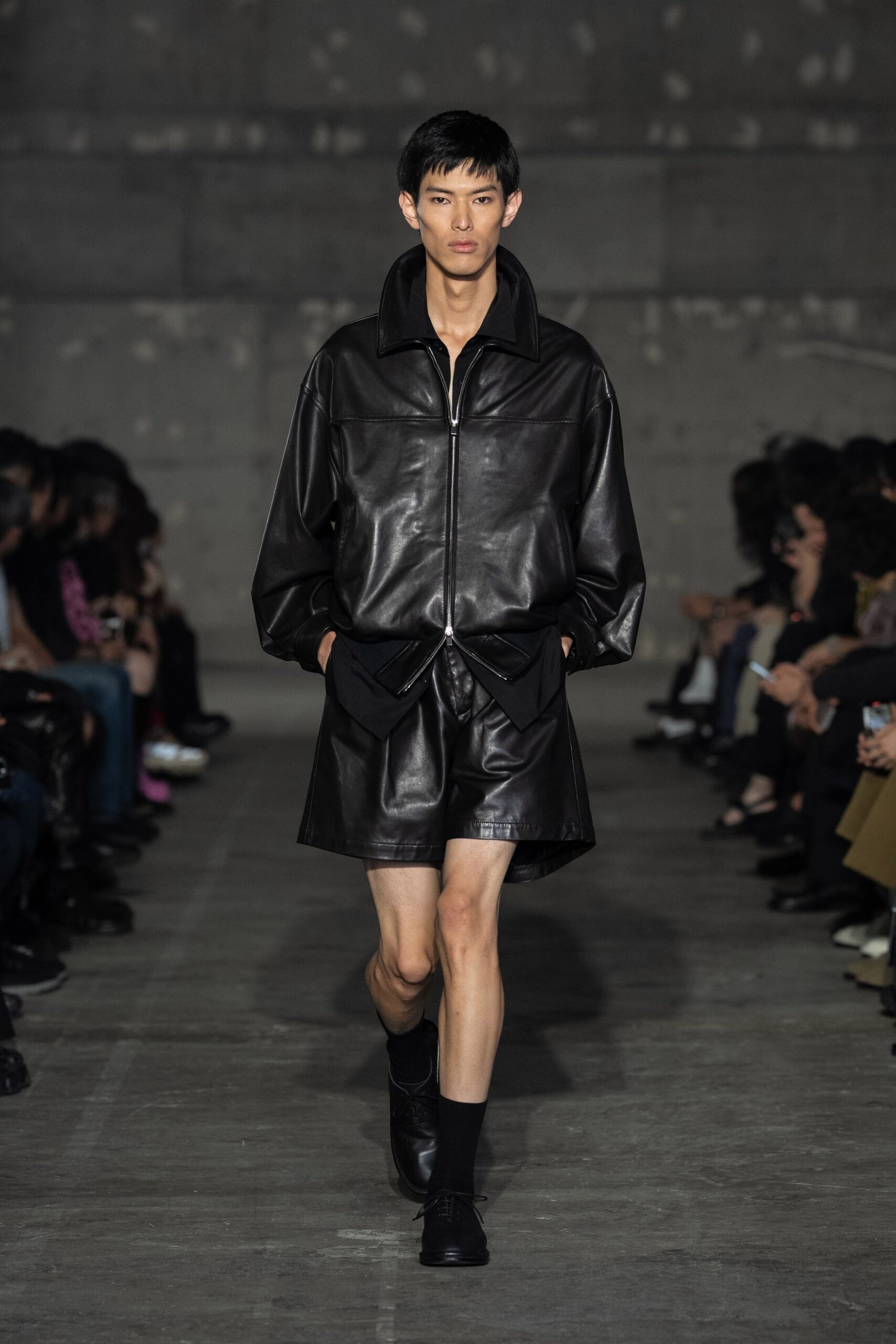 black leather long-sleeve collared oversized zippered pockets jacket