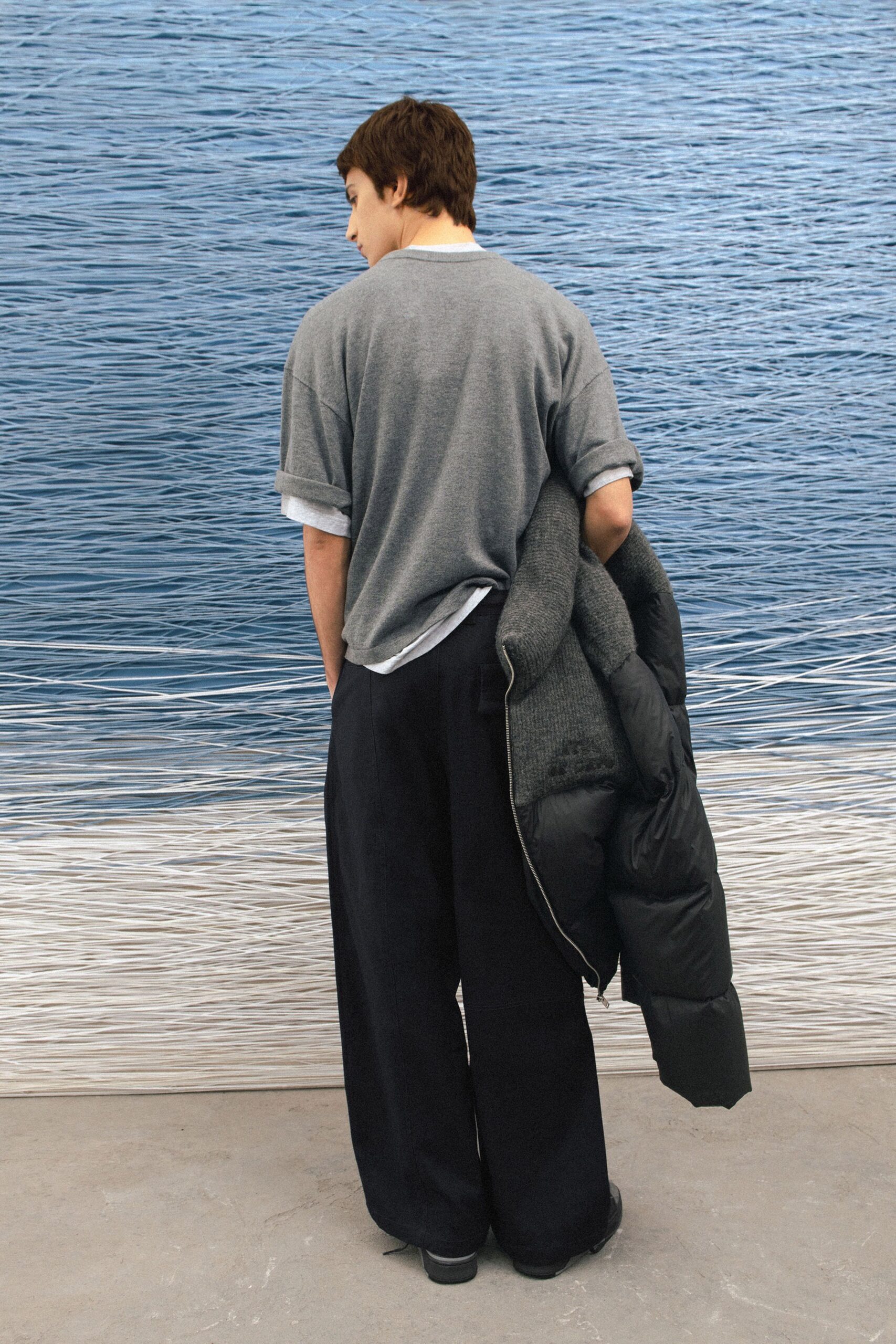 gray shirt black pants oversized jacket