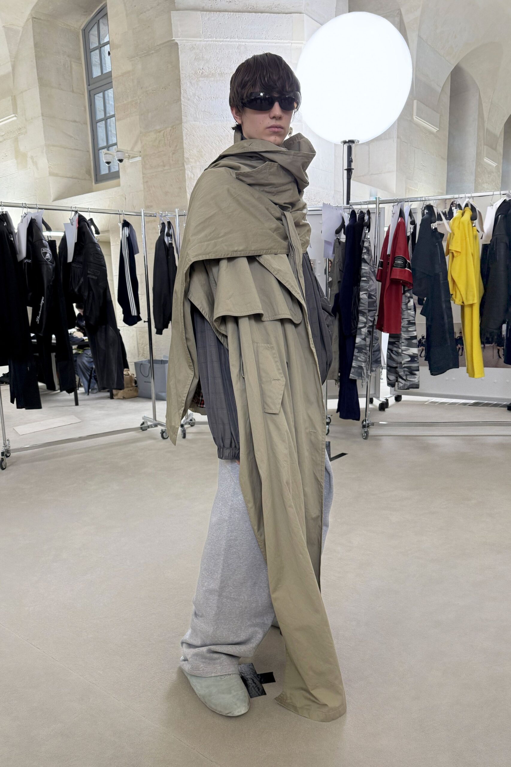 beige coat gray shirt relaxed pants
