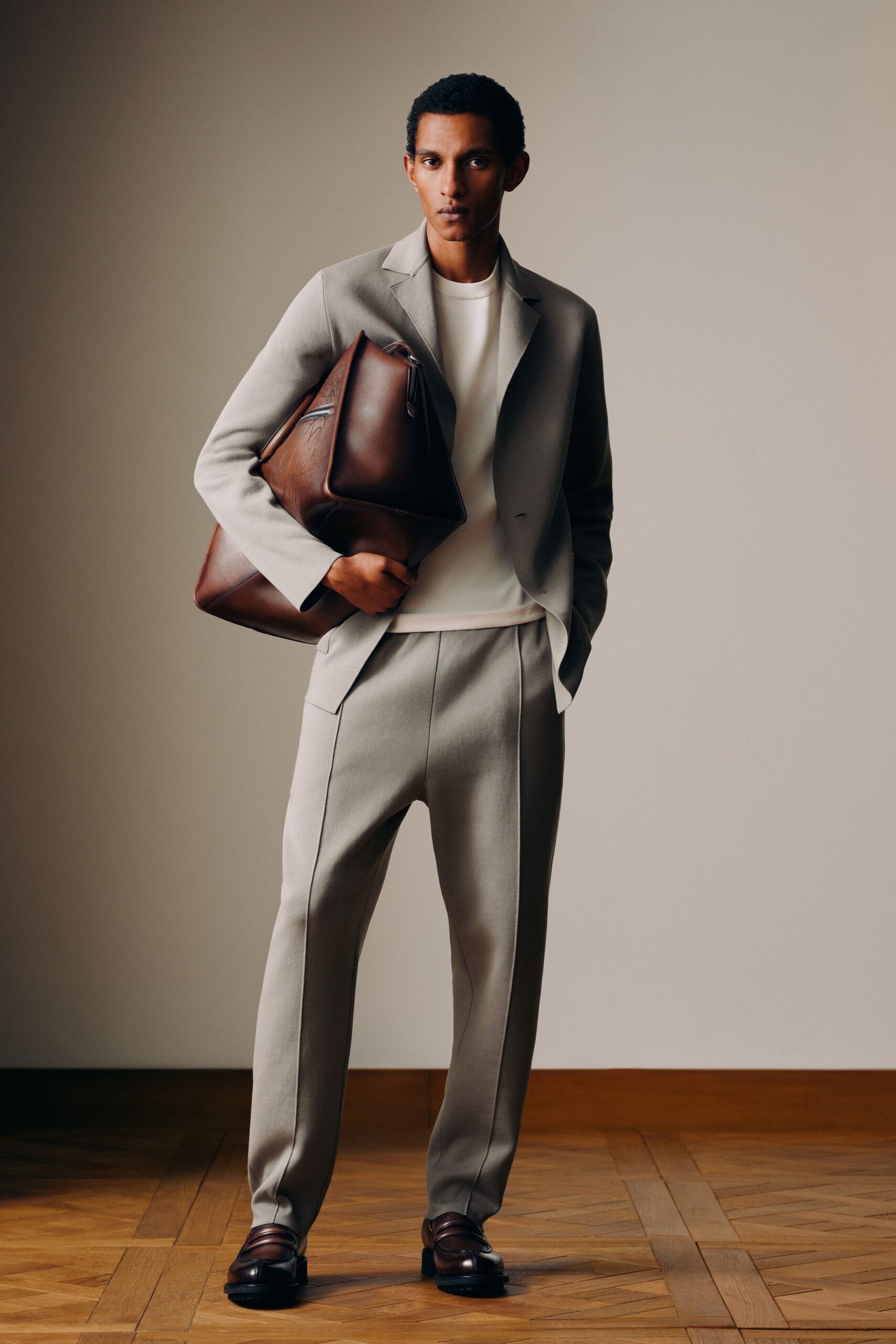 beige tailored suit with brown accessories