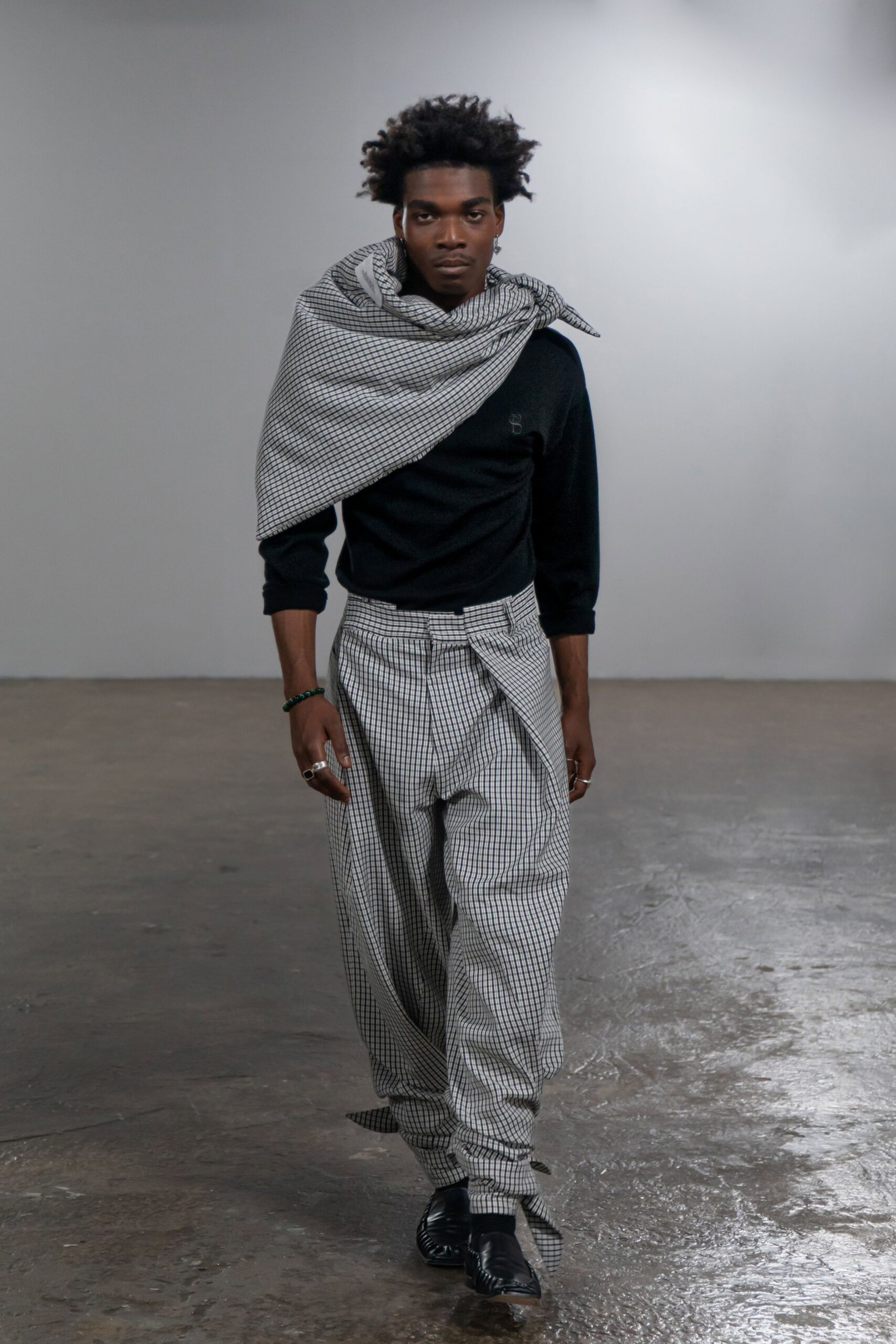 black fitted top with checked pants