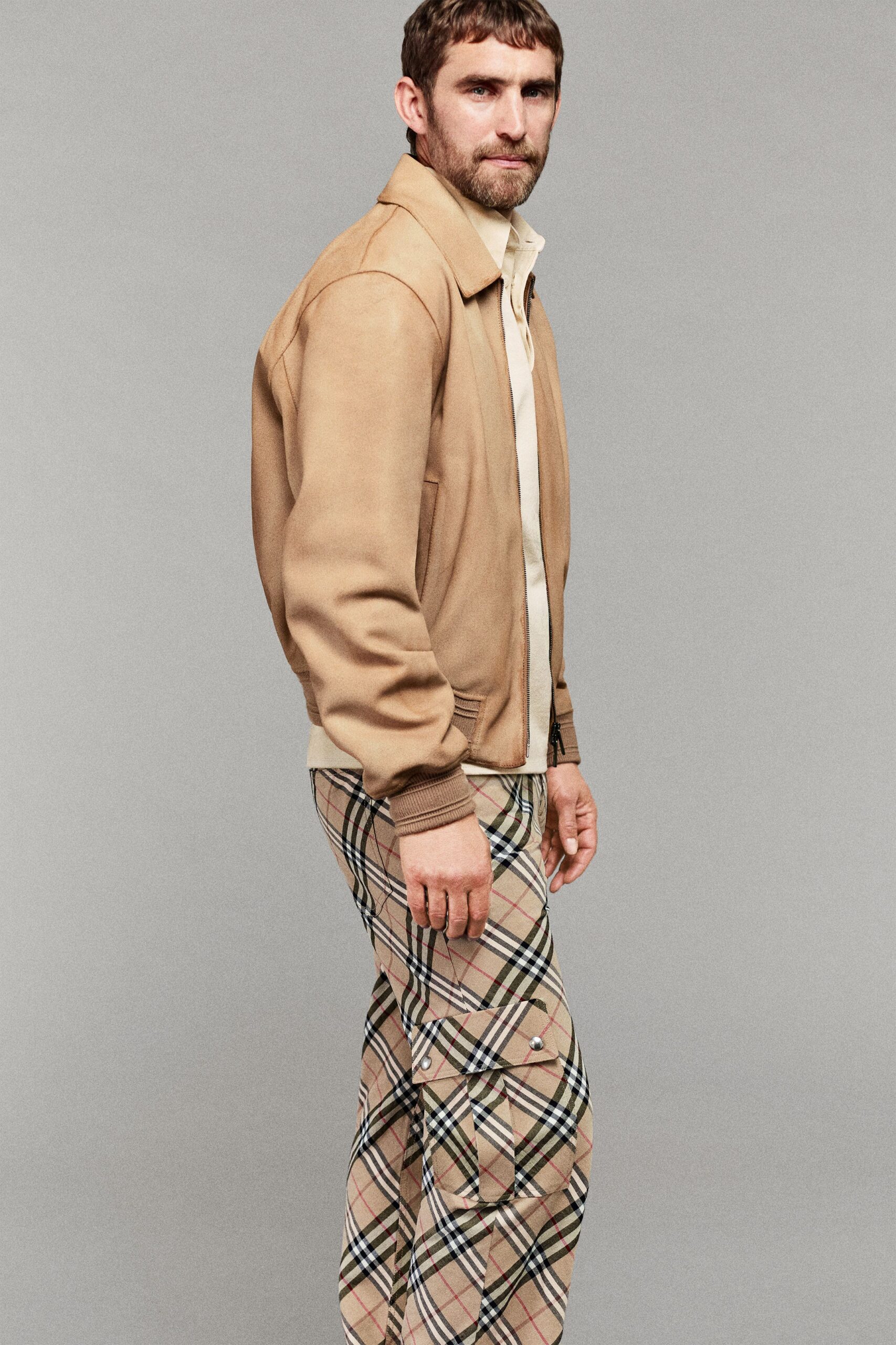beige leather jacket with checked pants