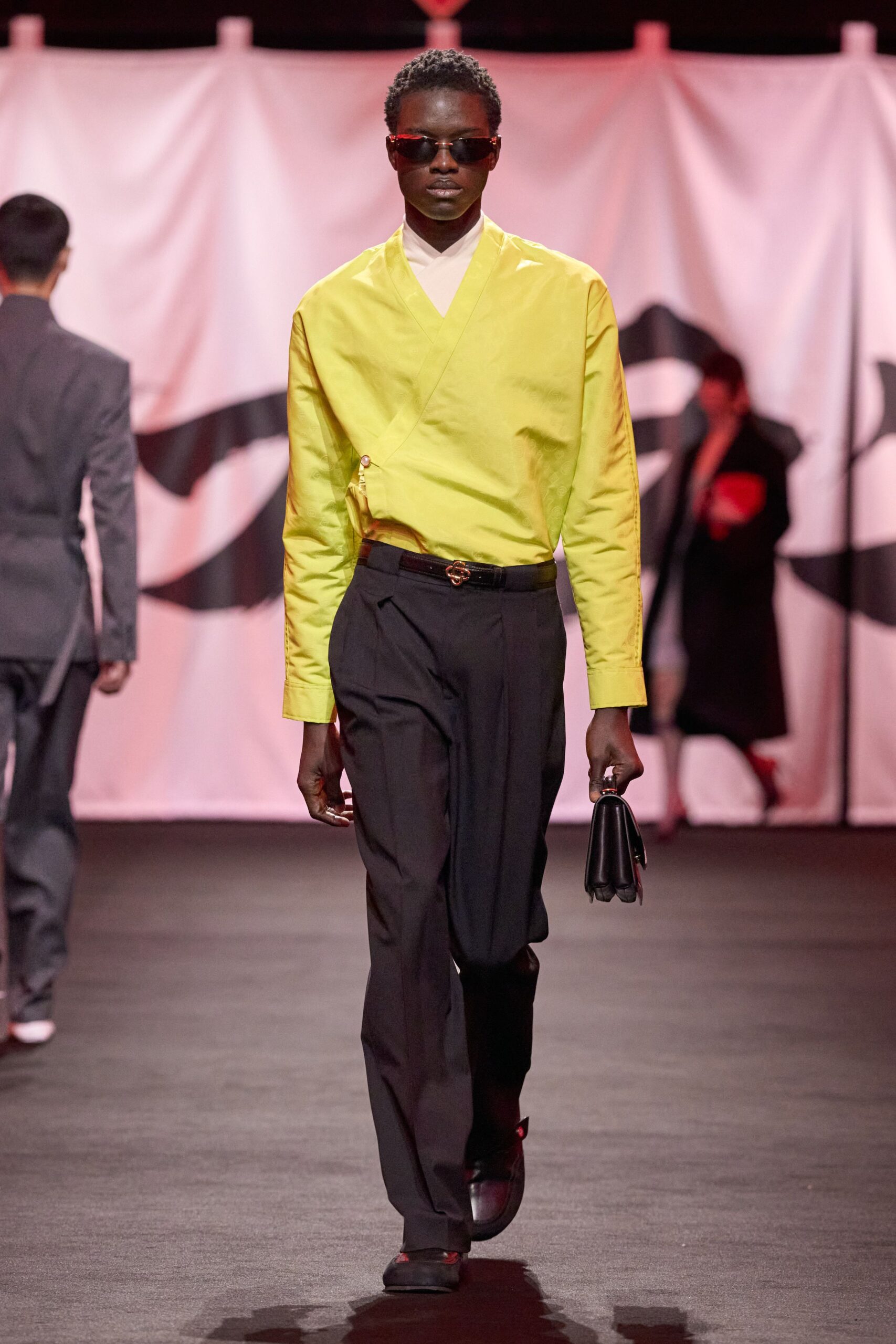 yellow fitted shirt with black pants