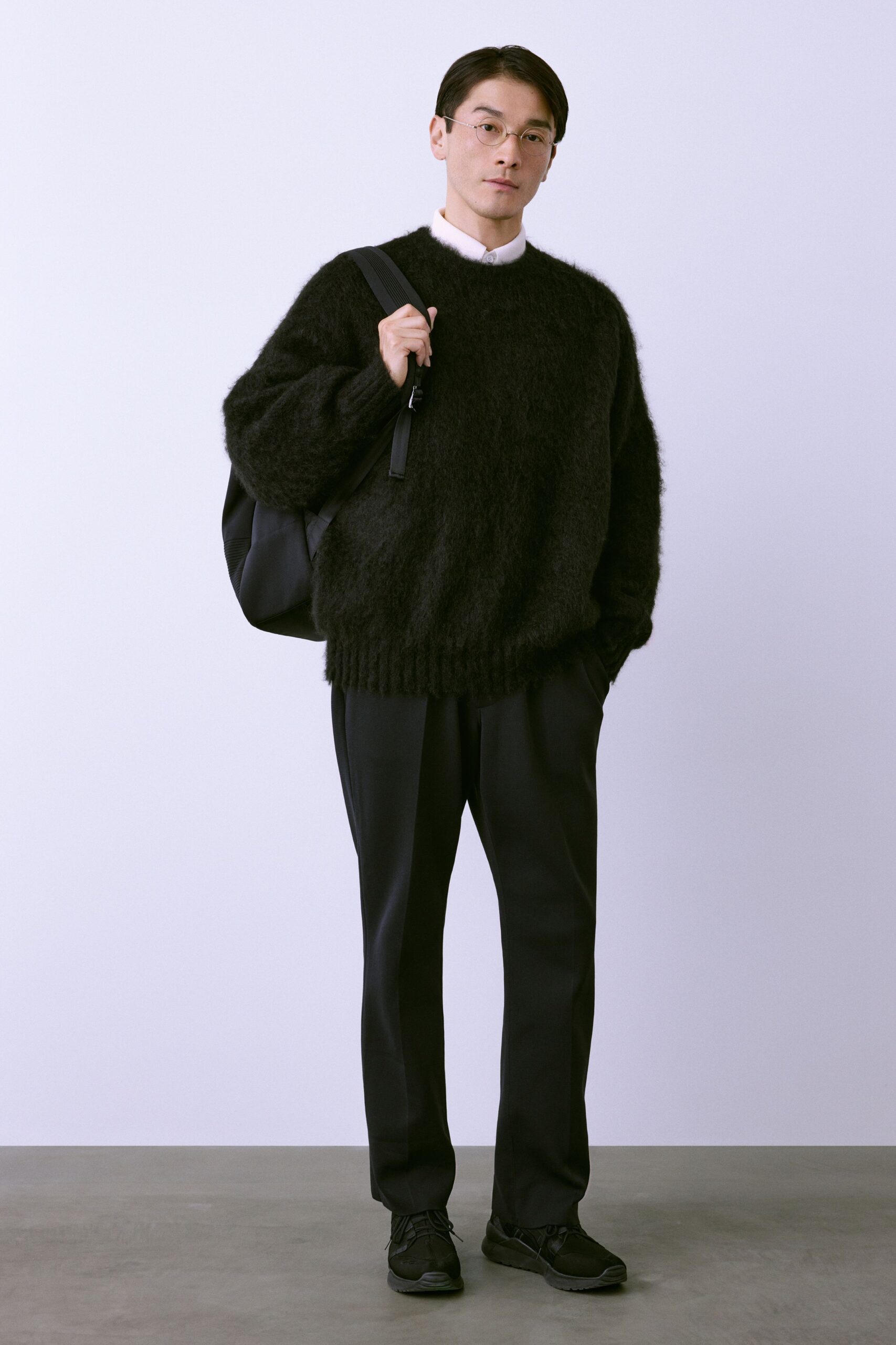 black relaxed wool sweater with tailored pants