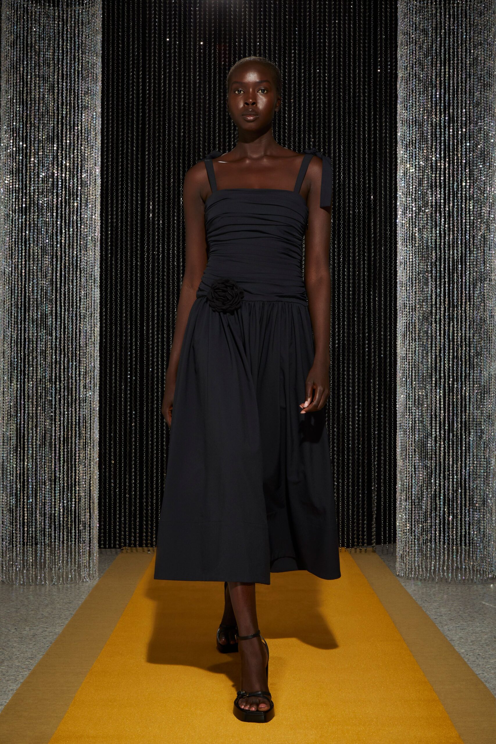 black midi dress with strappy shoes