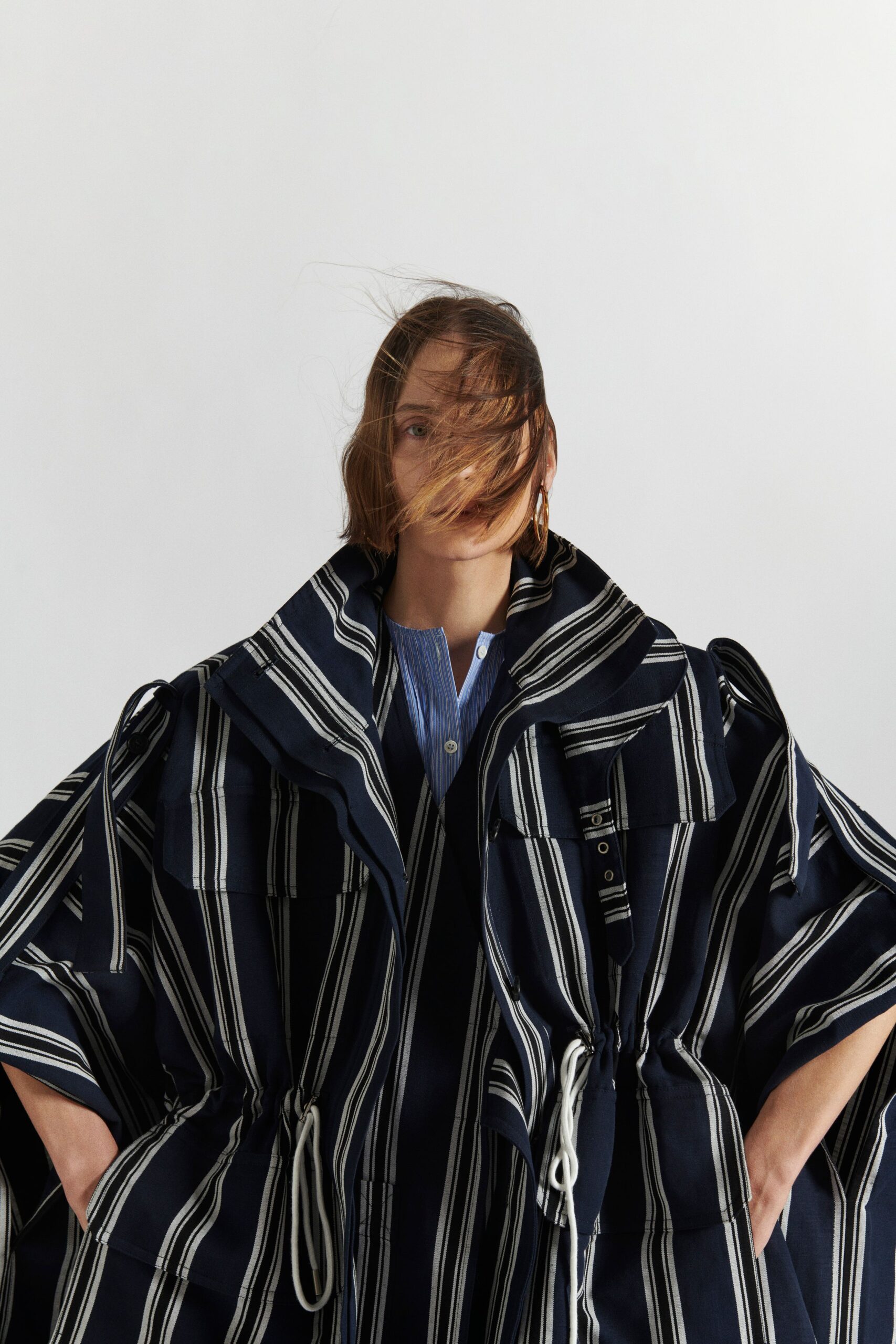 blue and white striped poncho