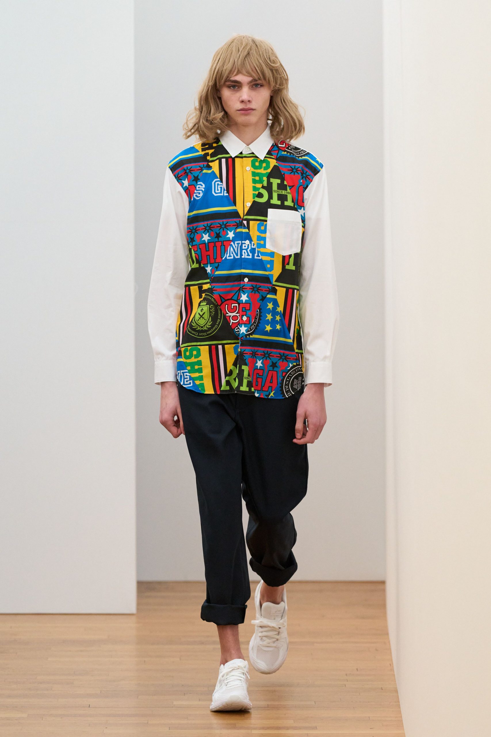 multi-colored printed shirt with black pants