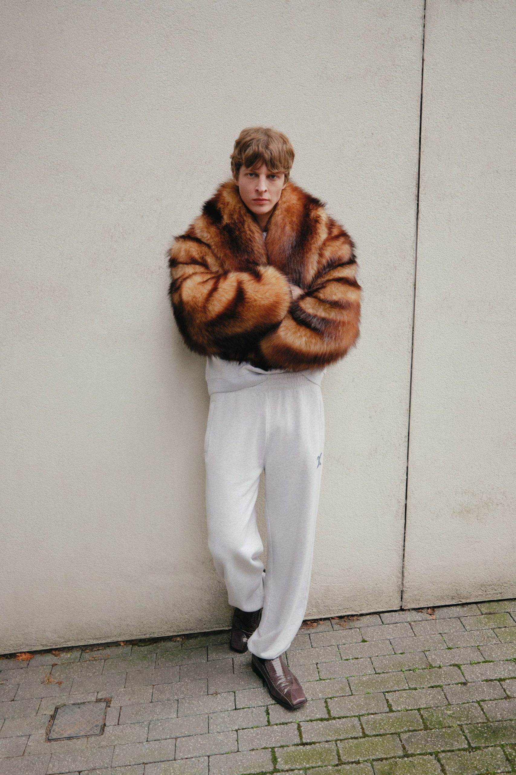 brown fur coat with white pants