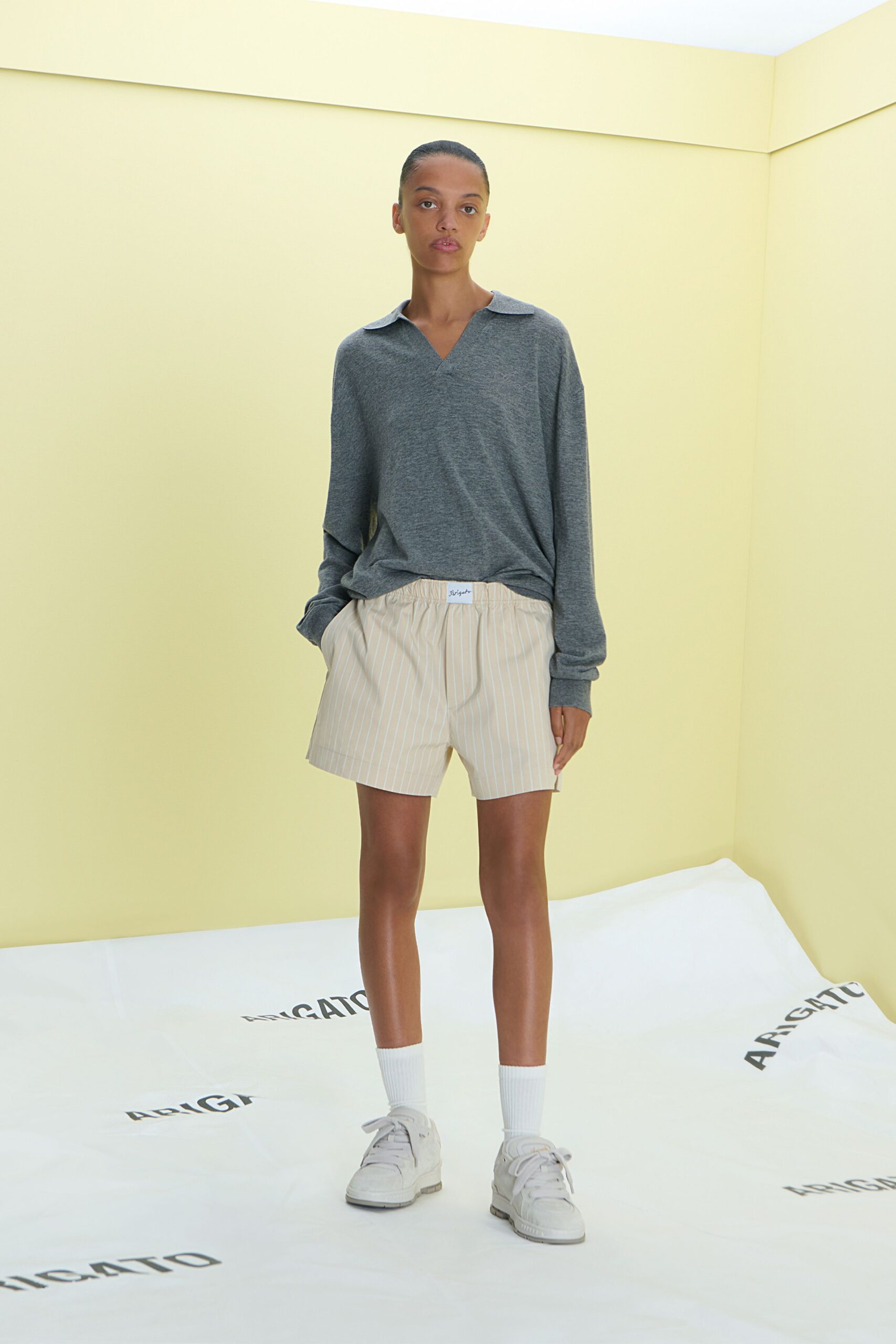 gray relaxed shirt with beige shorts