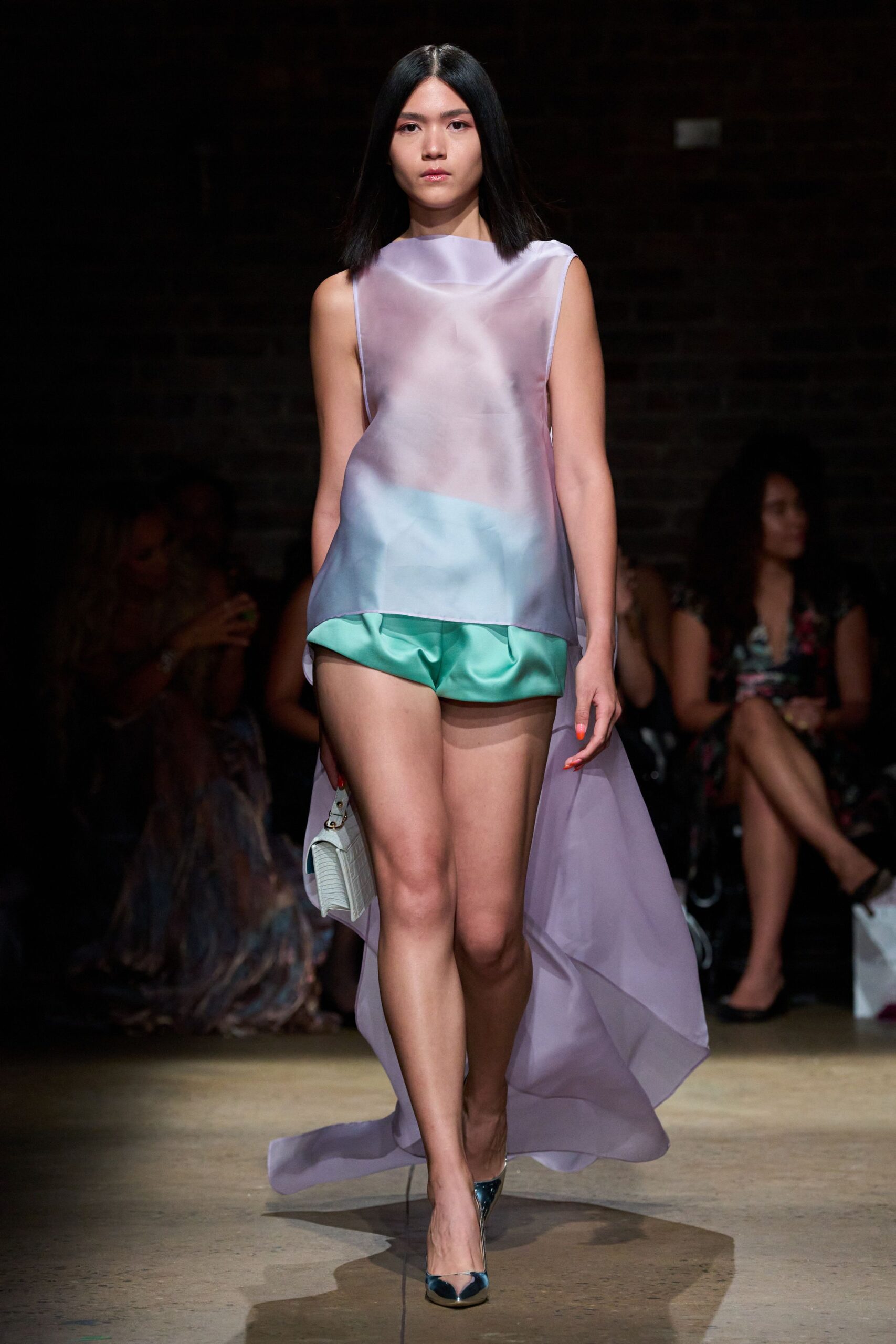 sheer purple top with green shorts