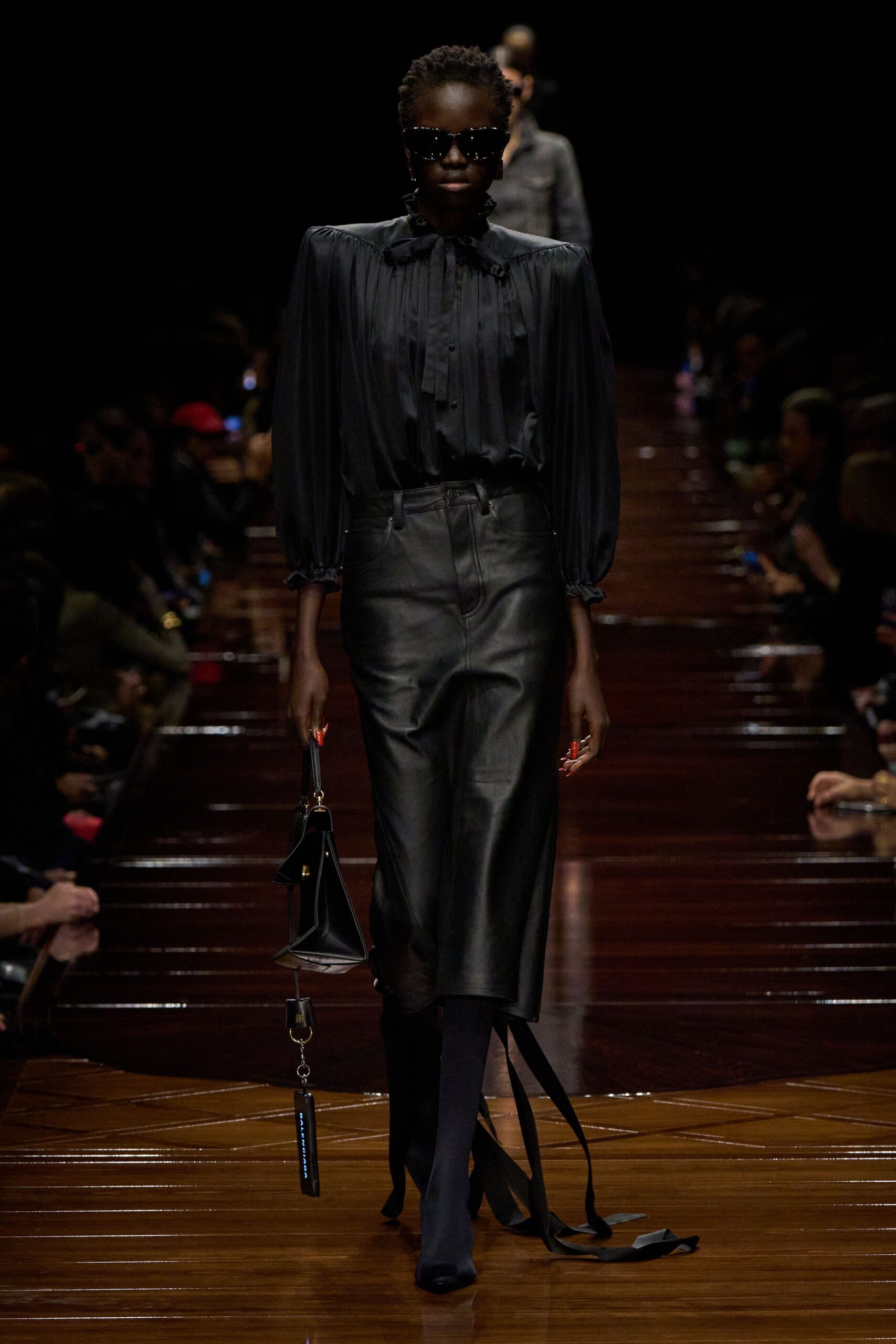 black silk blouse and leather skirt