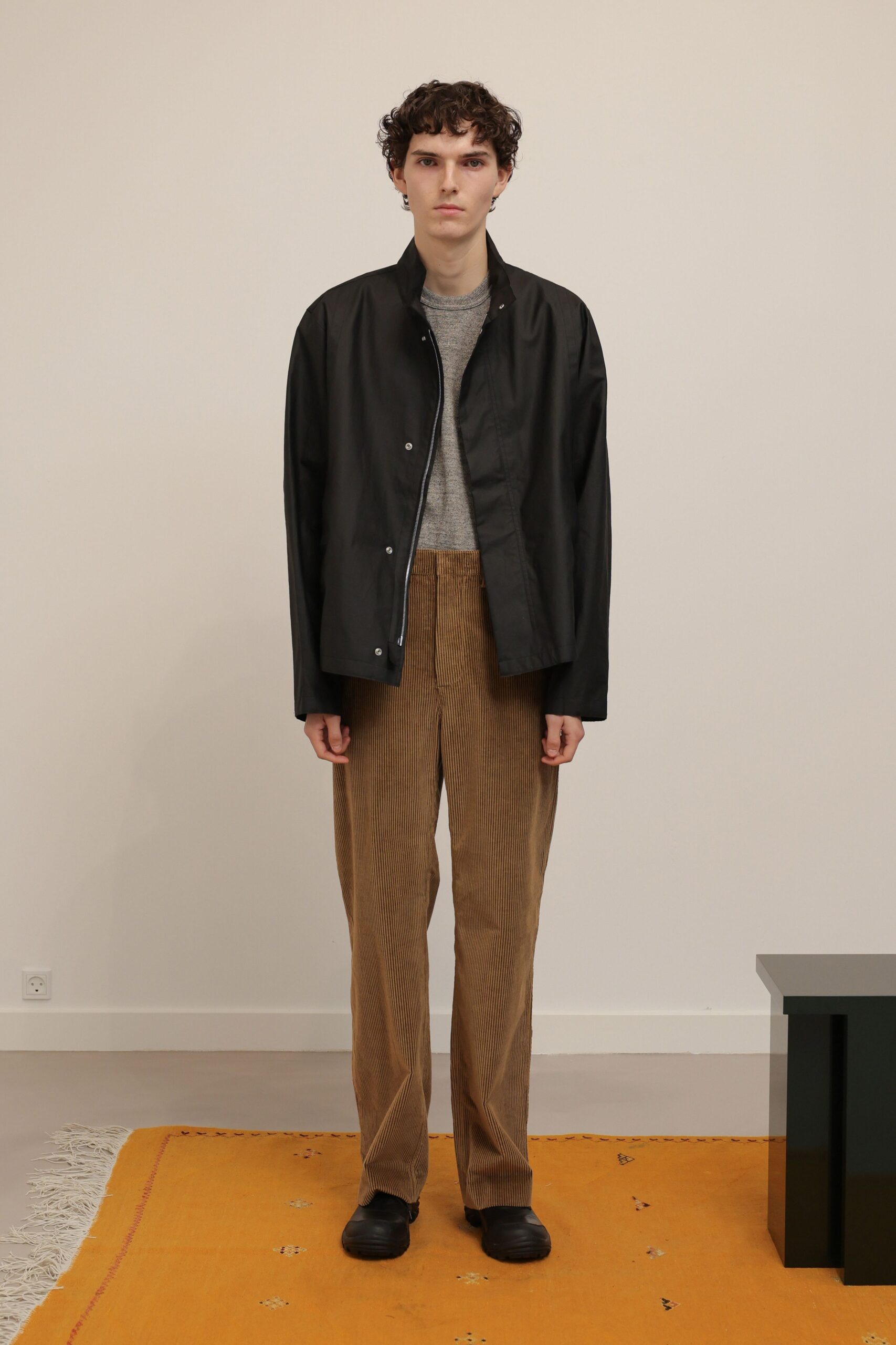 black cotton long-sleeve collared oversized zippered buttoned jacket
