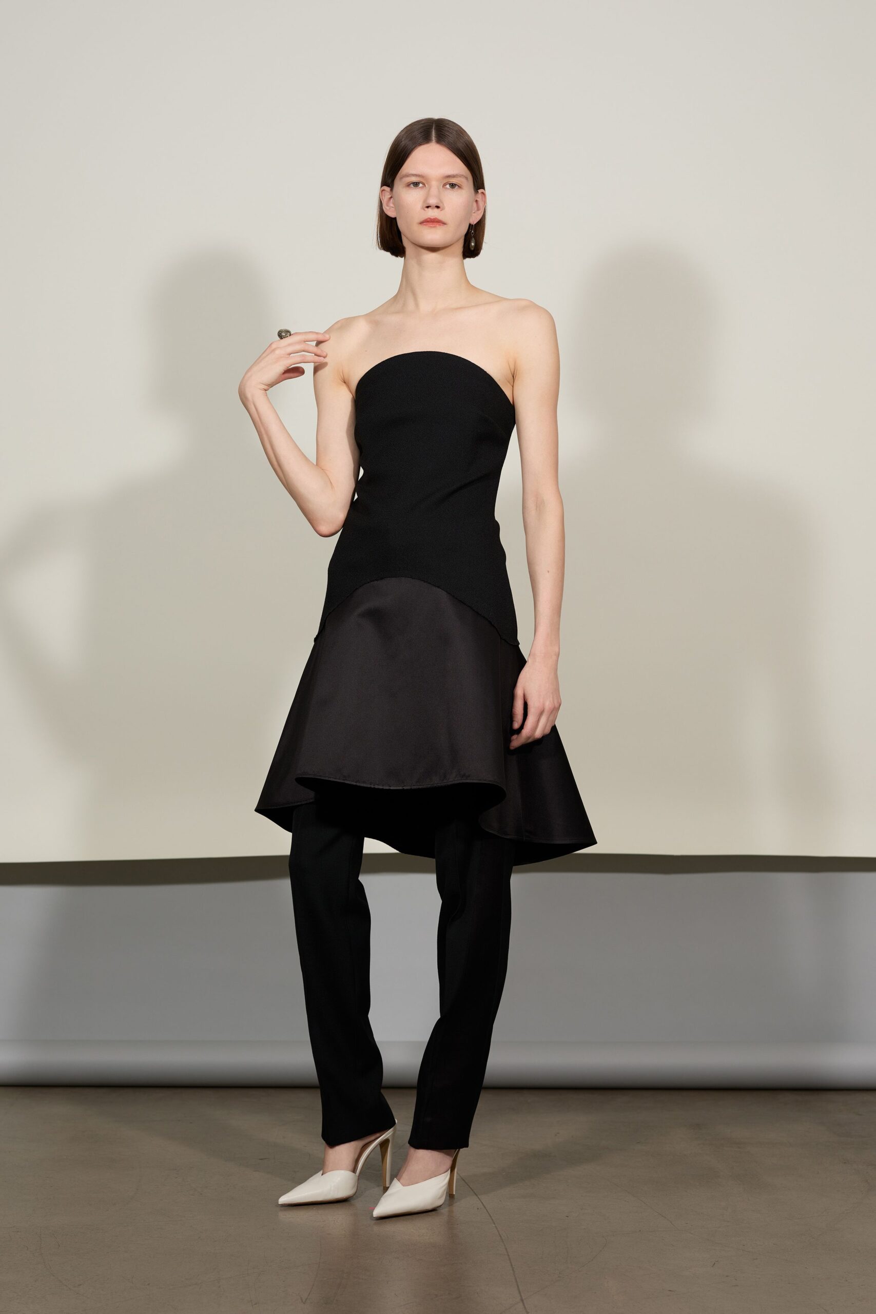 black fitted strapless top with asymmetric skirt