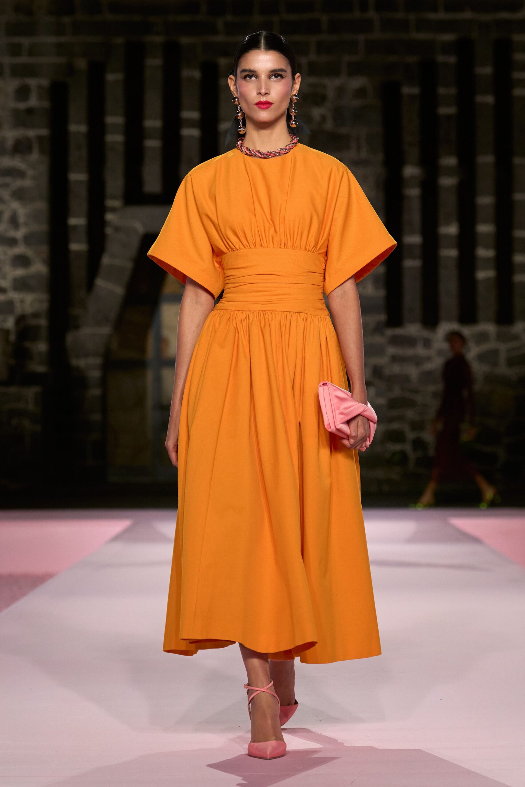 orange midi dress with pink accessories
