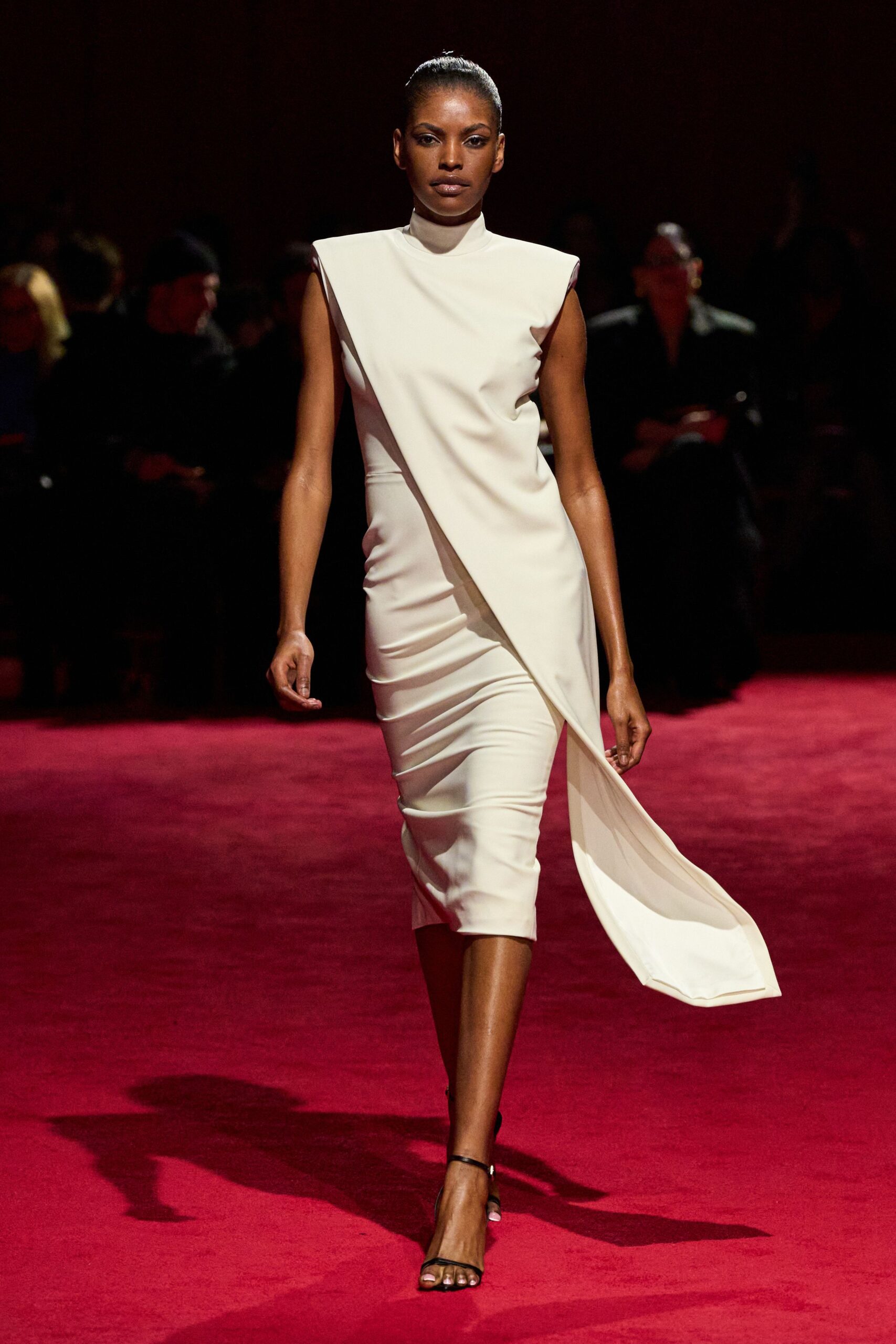 white fitted asymmetric dress with black shoes