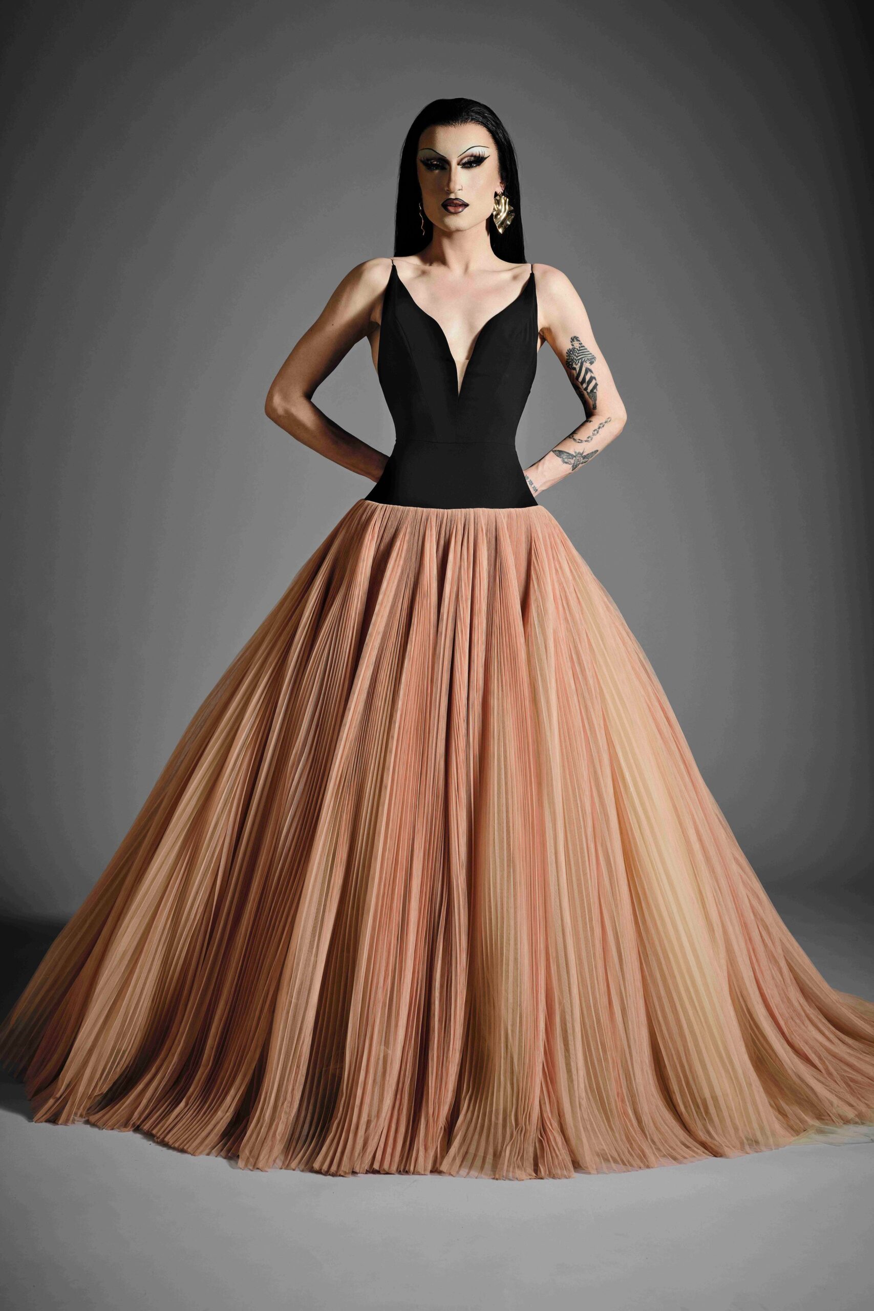 black and beige pleated gown