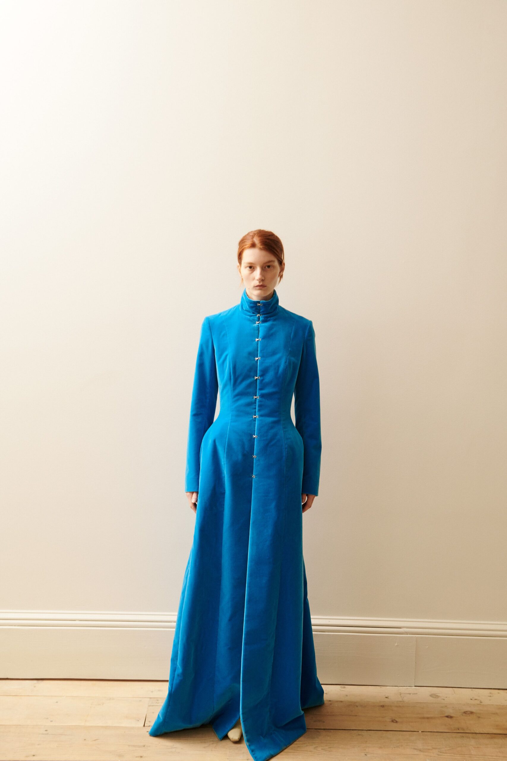 blue fitted long-sleeve gown