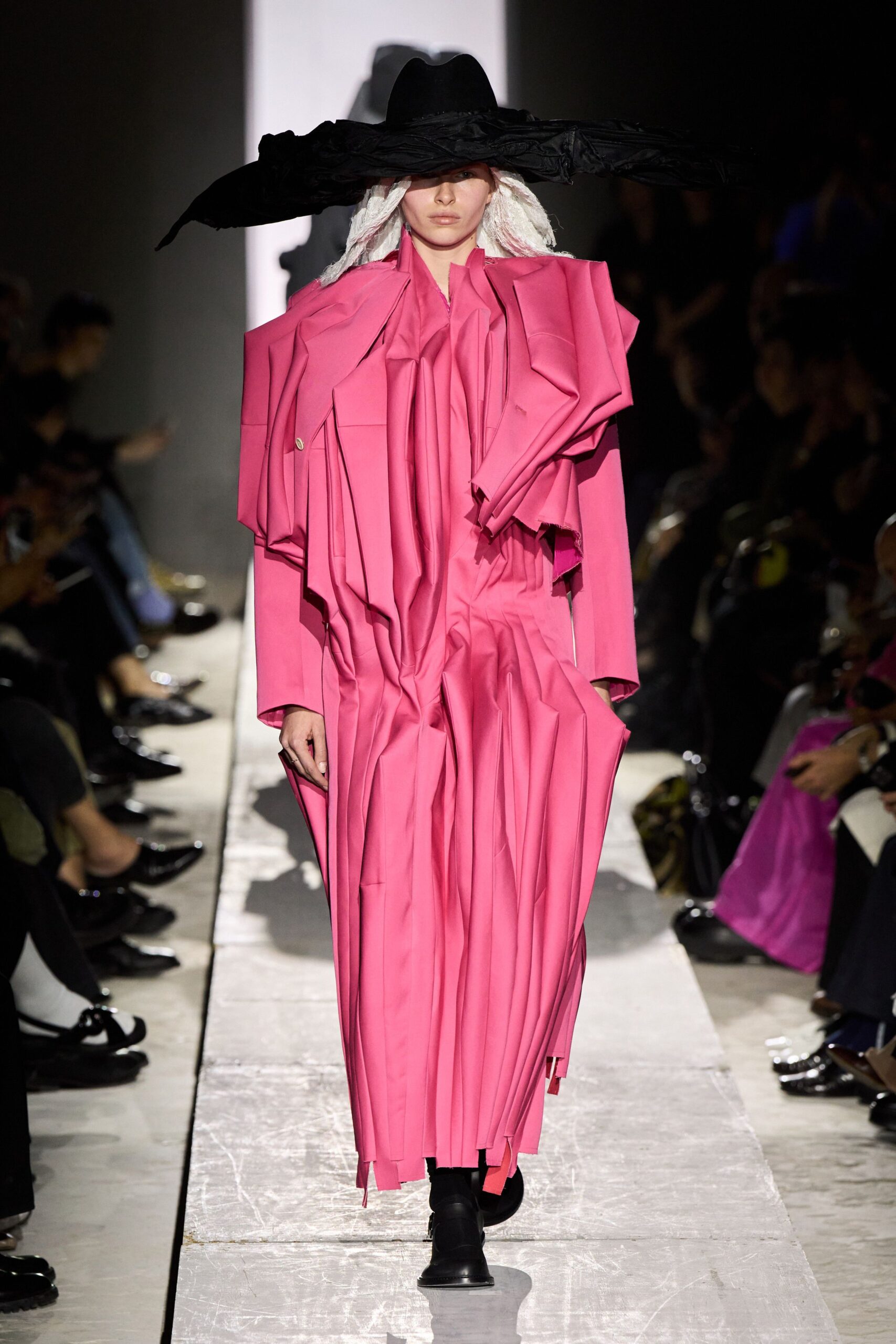 pink pleated maxi dress with black hat