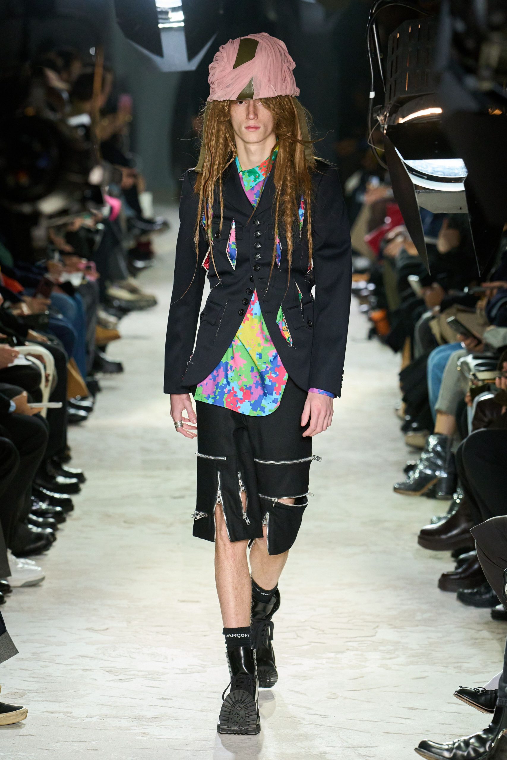 black blazer multi shirt black shorts