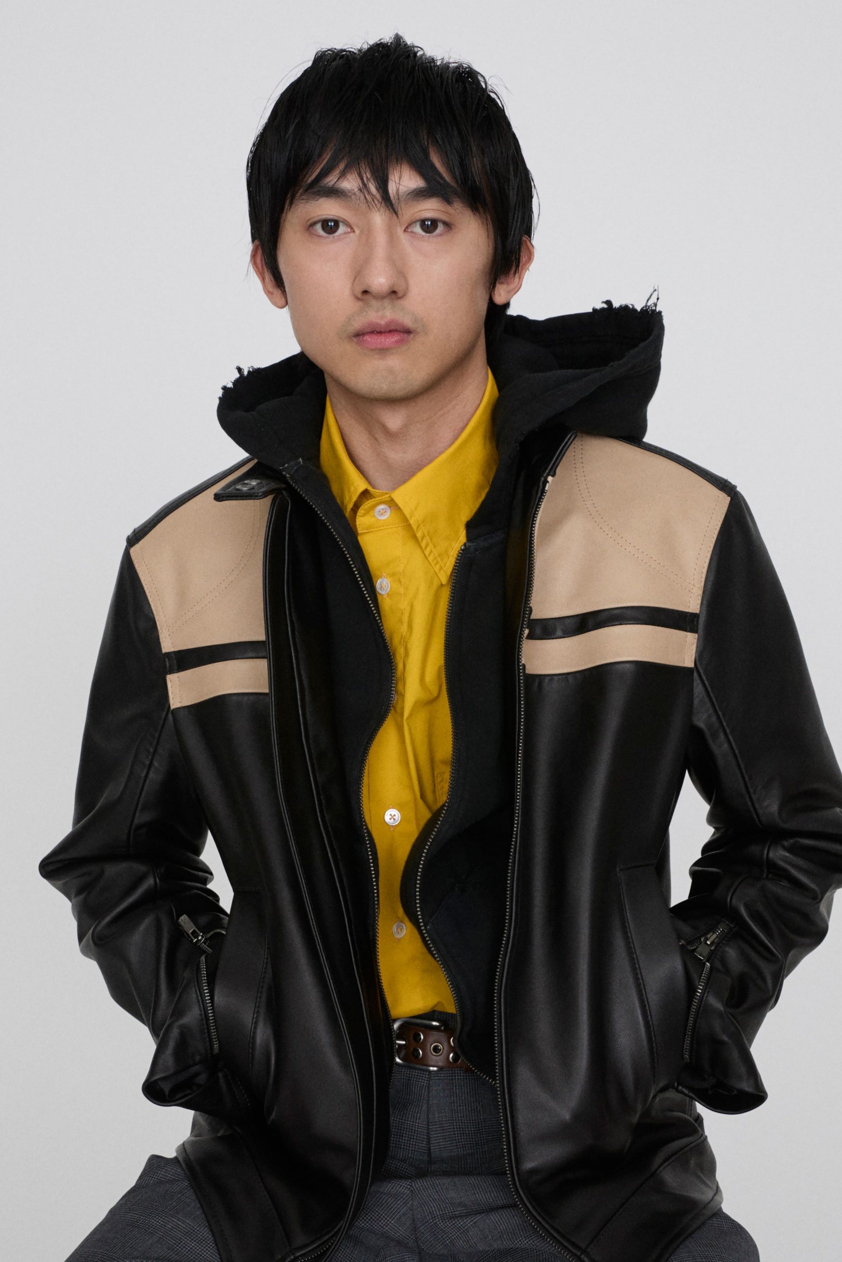 black leather jacket with yellow shirt