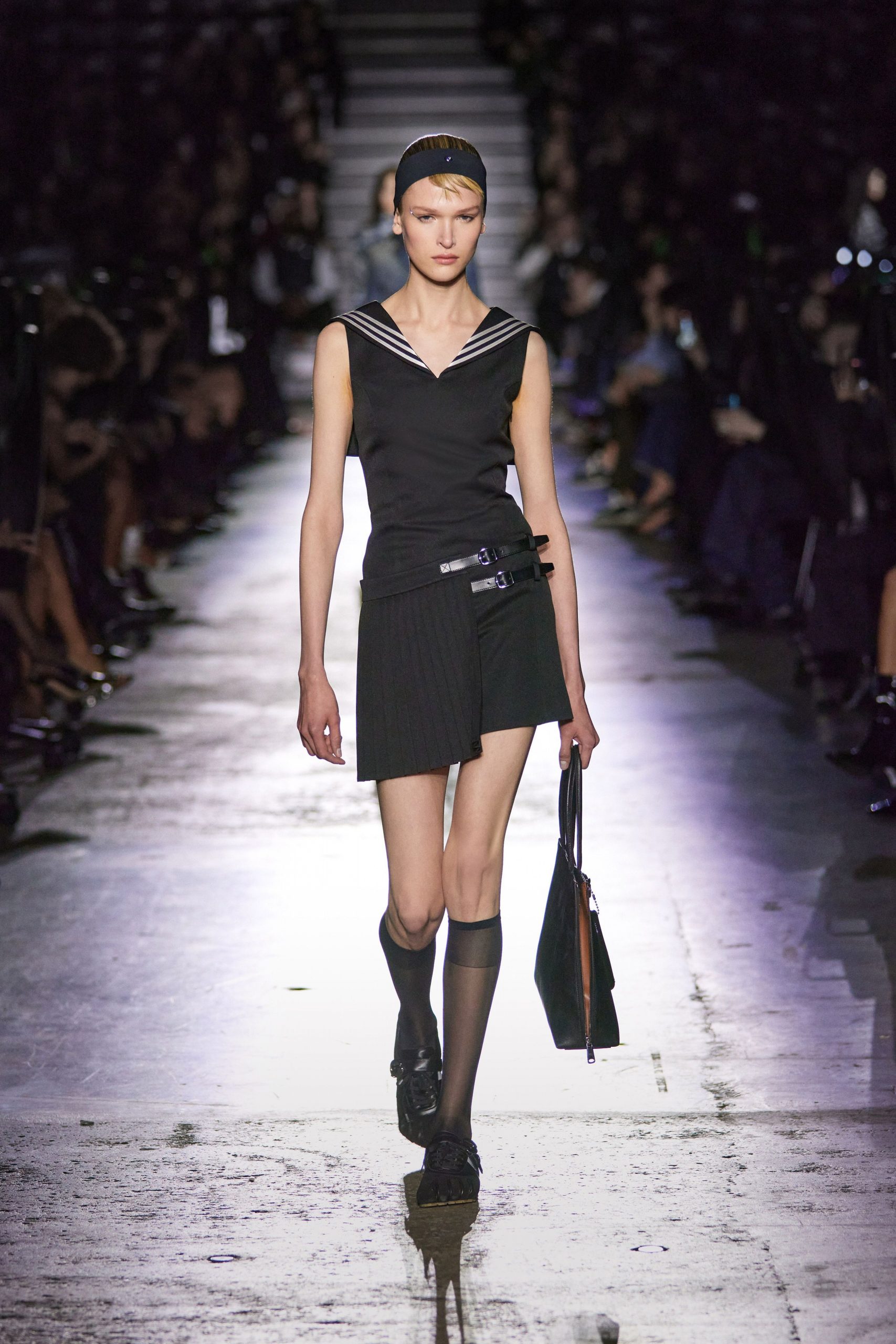 black fitted top and mini skirt