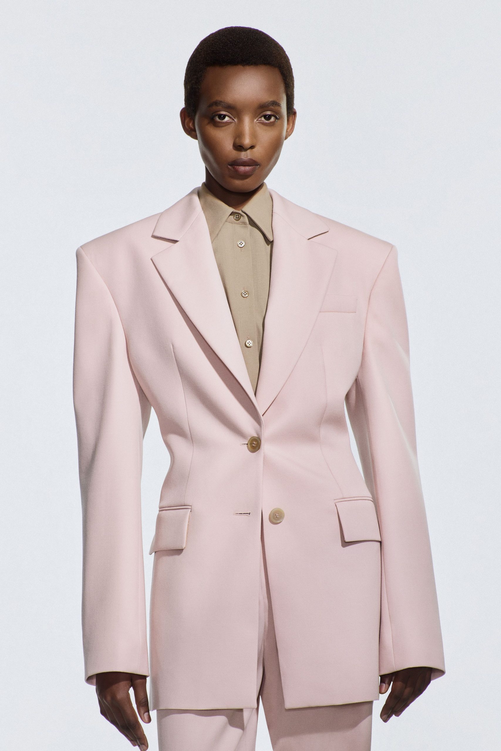 pink cotton long-sleeve collared oversized buttoned blazer