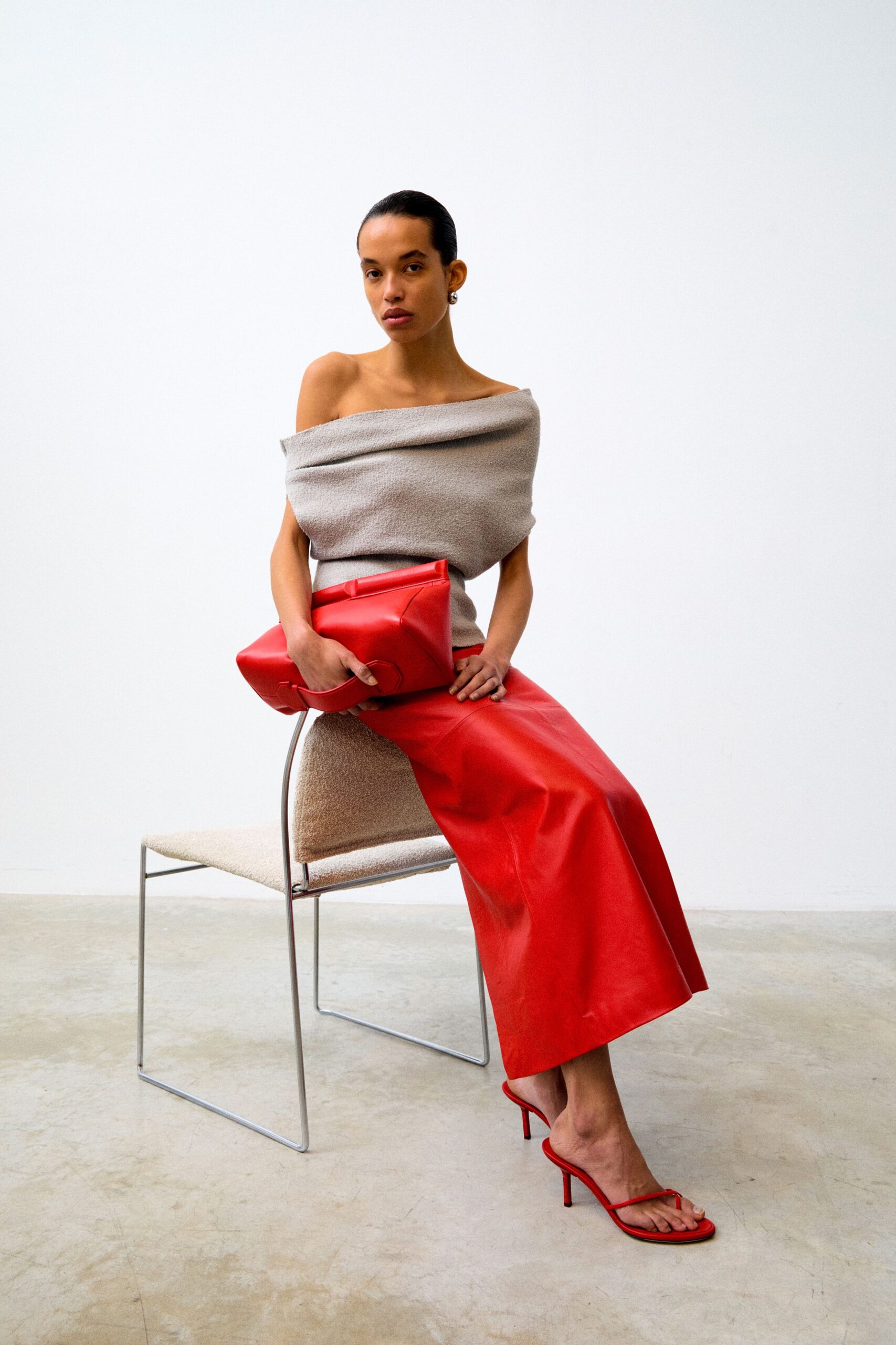 gray off-shoulder top red leather skirt