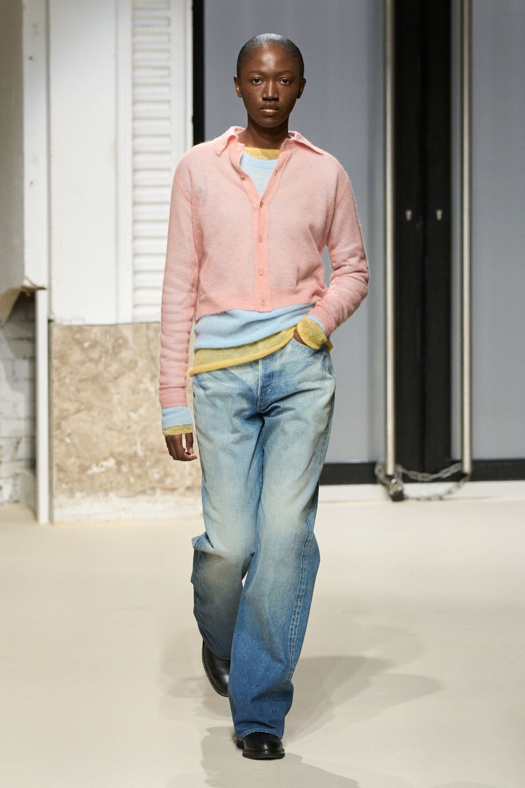pink cardigan with blue top and jeans