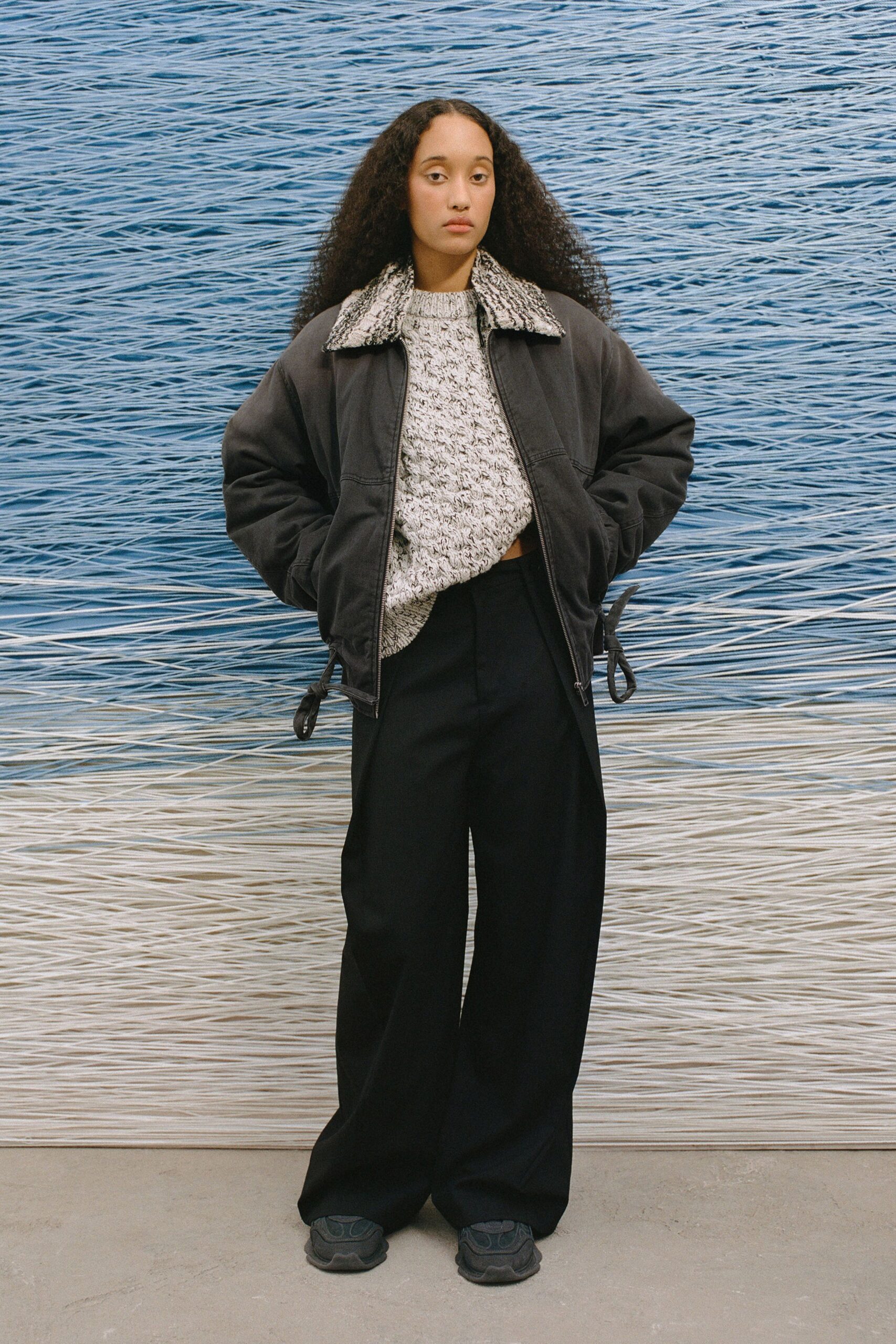 black relaxed jacket with gray sweater
