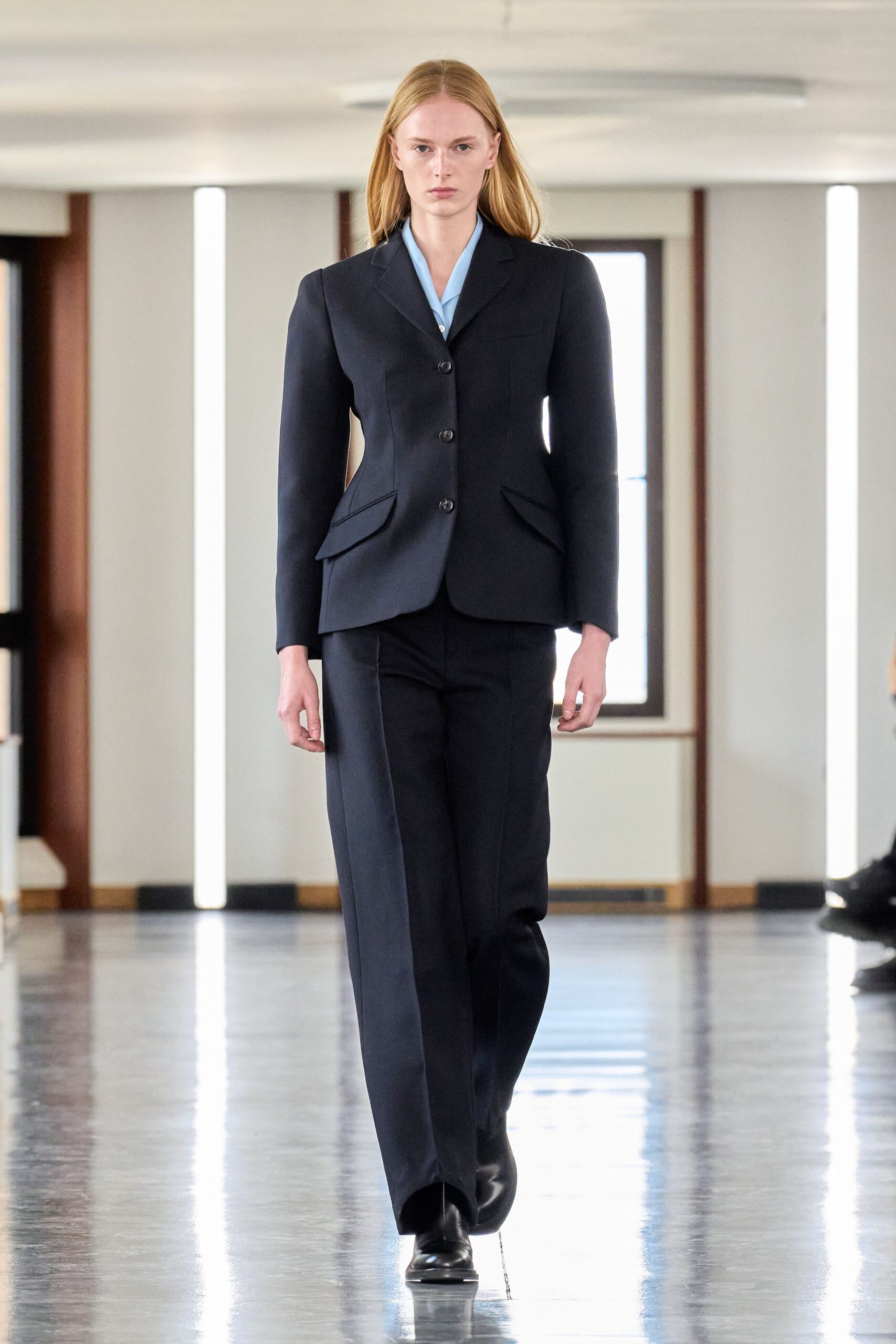 black tailored suit with light blue shirt