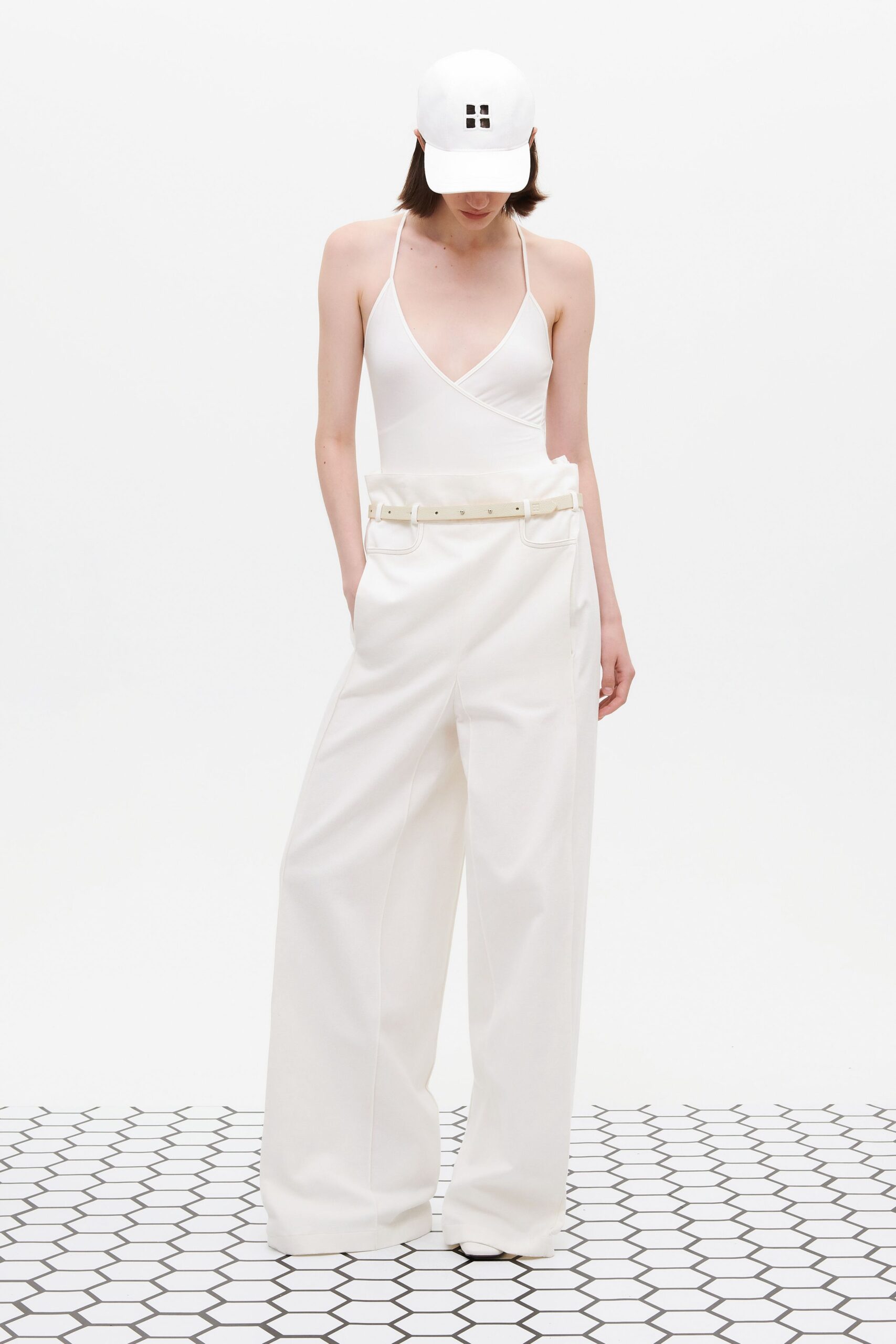 white bodysuit and wide-leg pants
