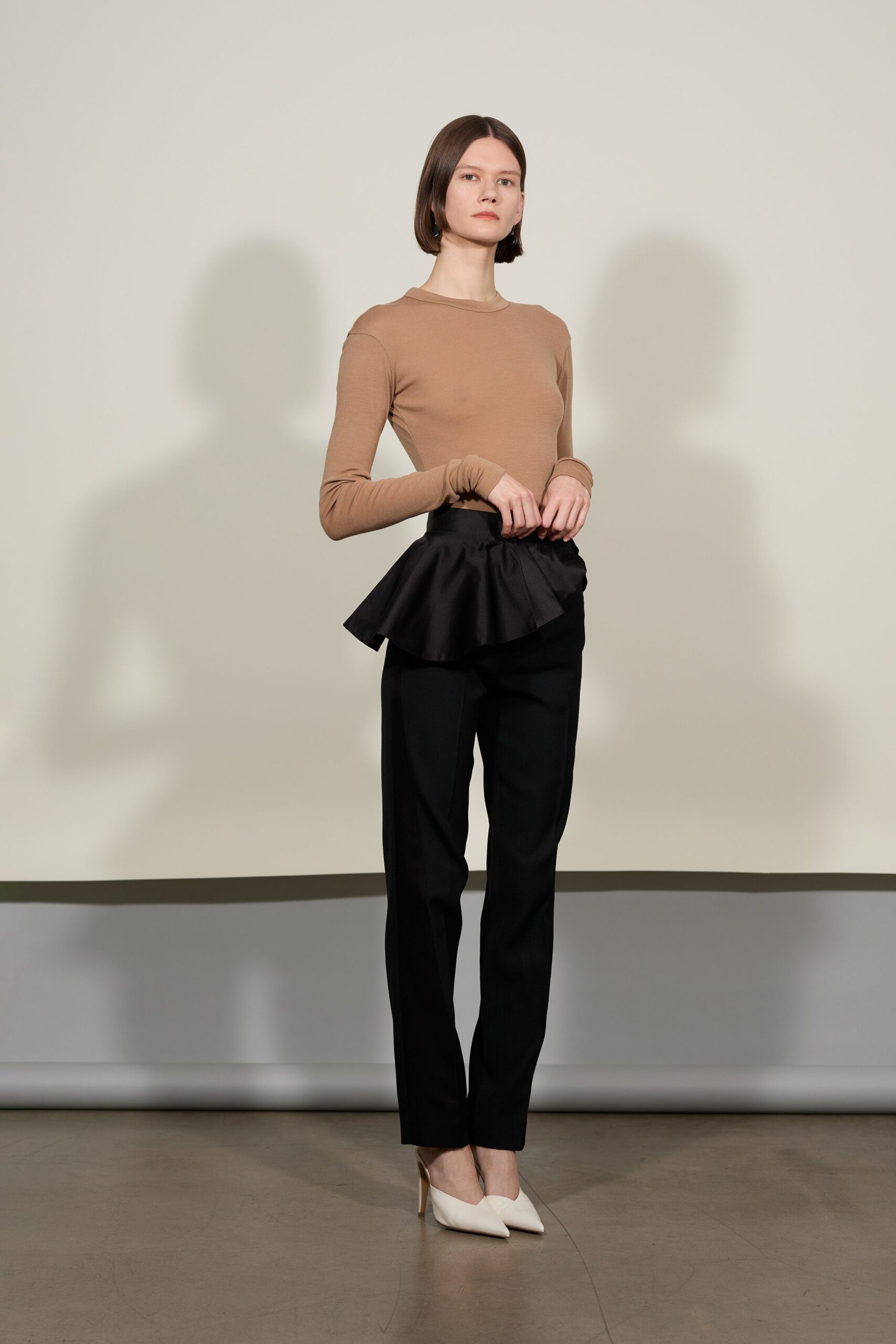 beige fitted top black tailored pants