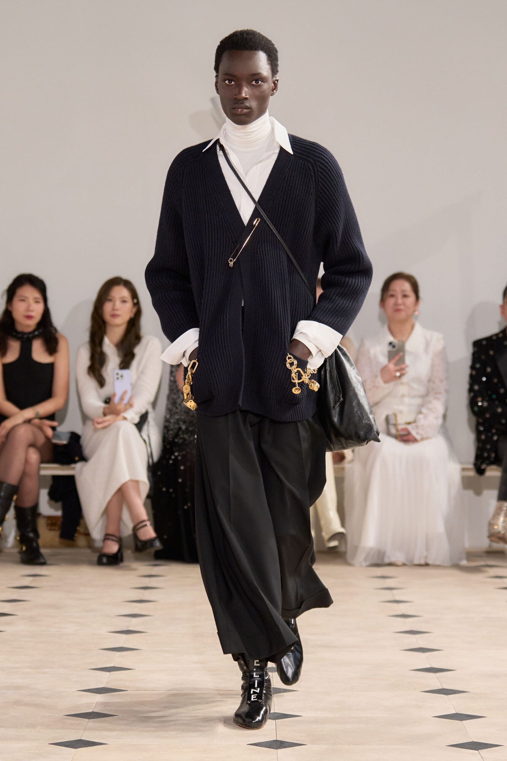black knit cardigan with white layers
