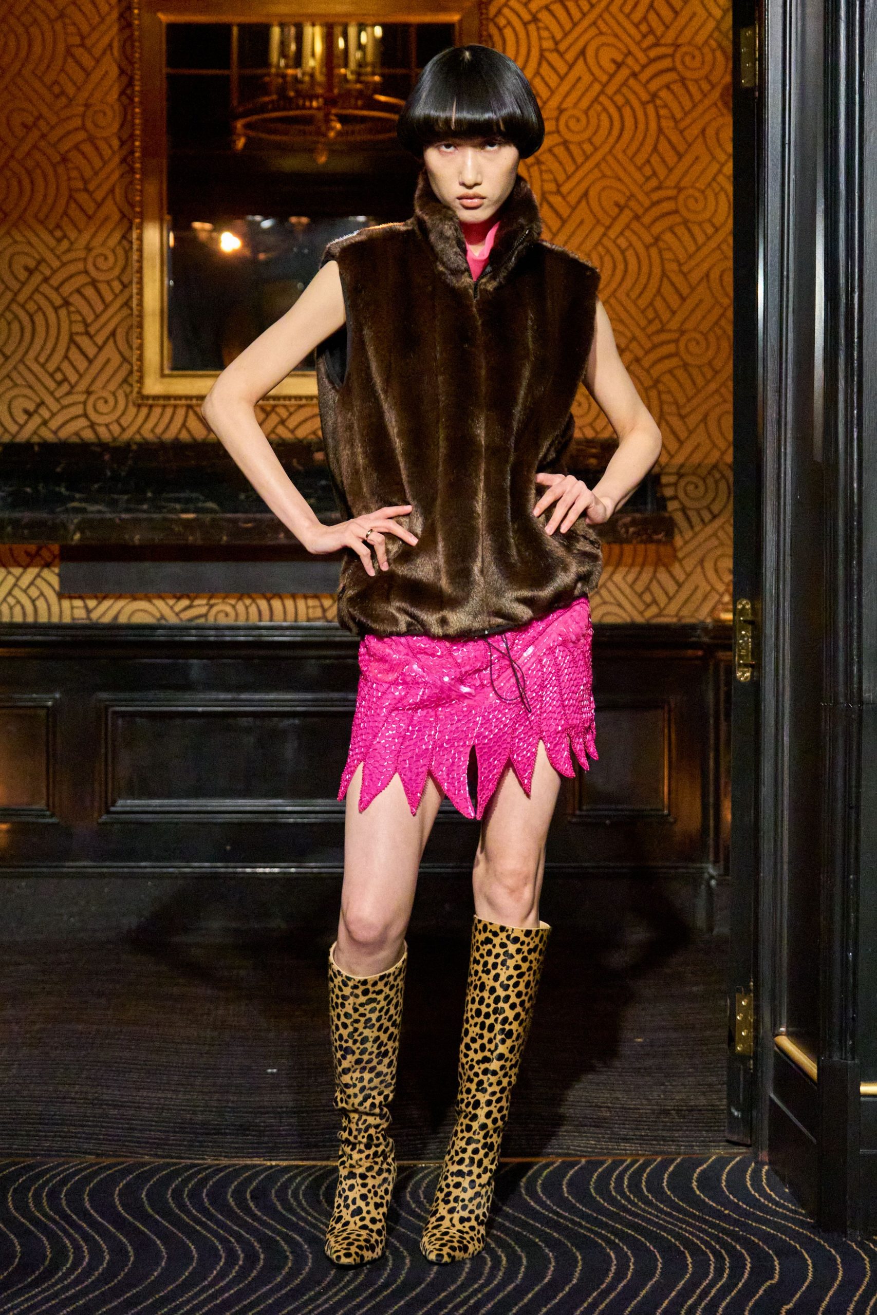 brown faux-fur vest and pink mini-dress