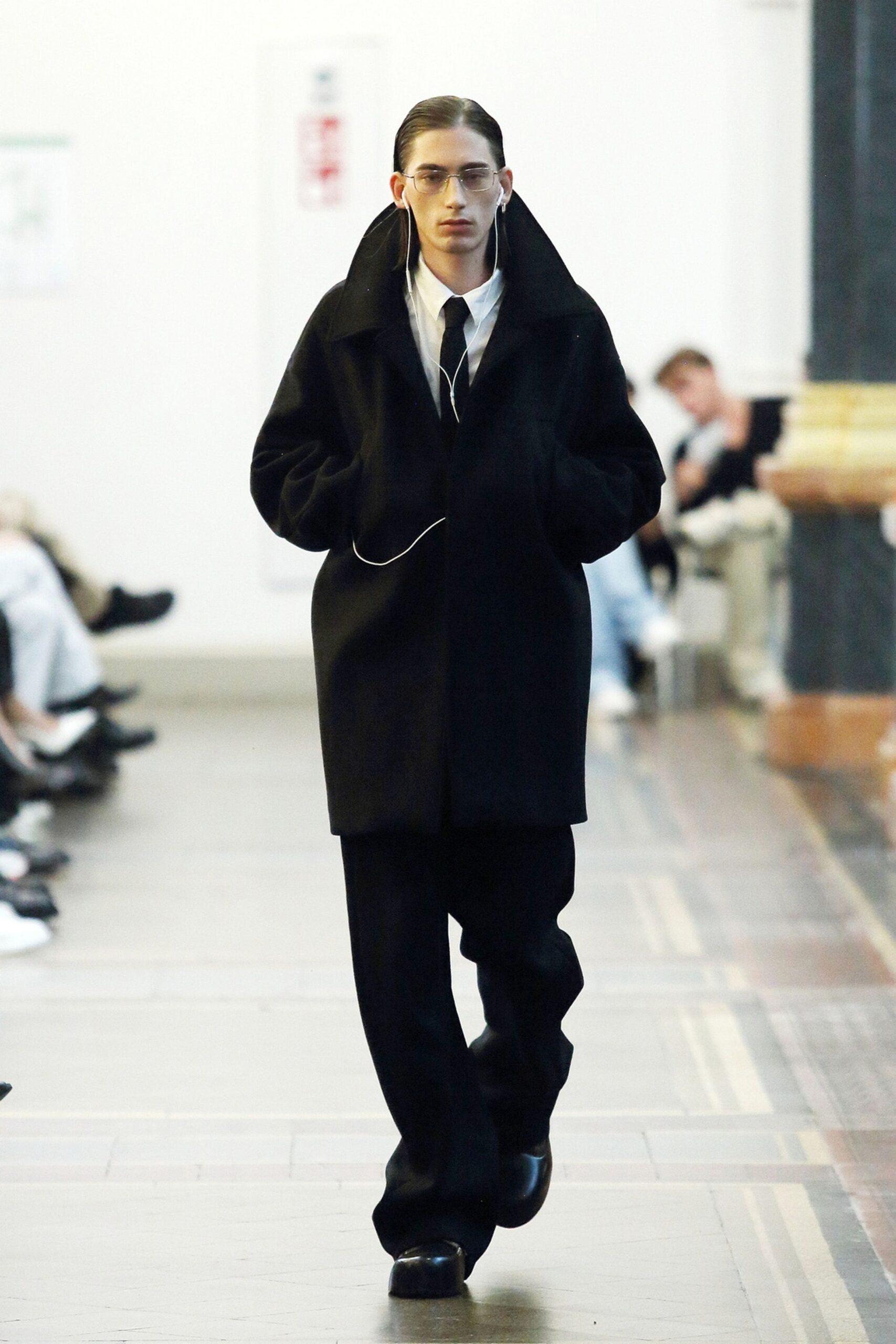 black oversized coat with relaxed pants