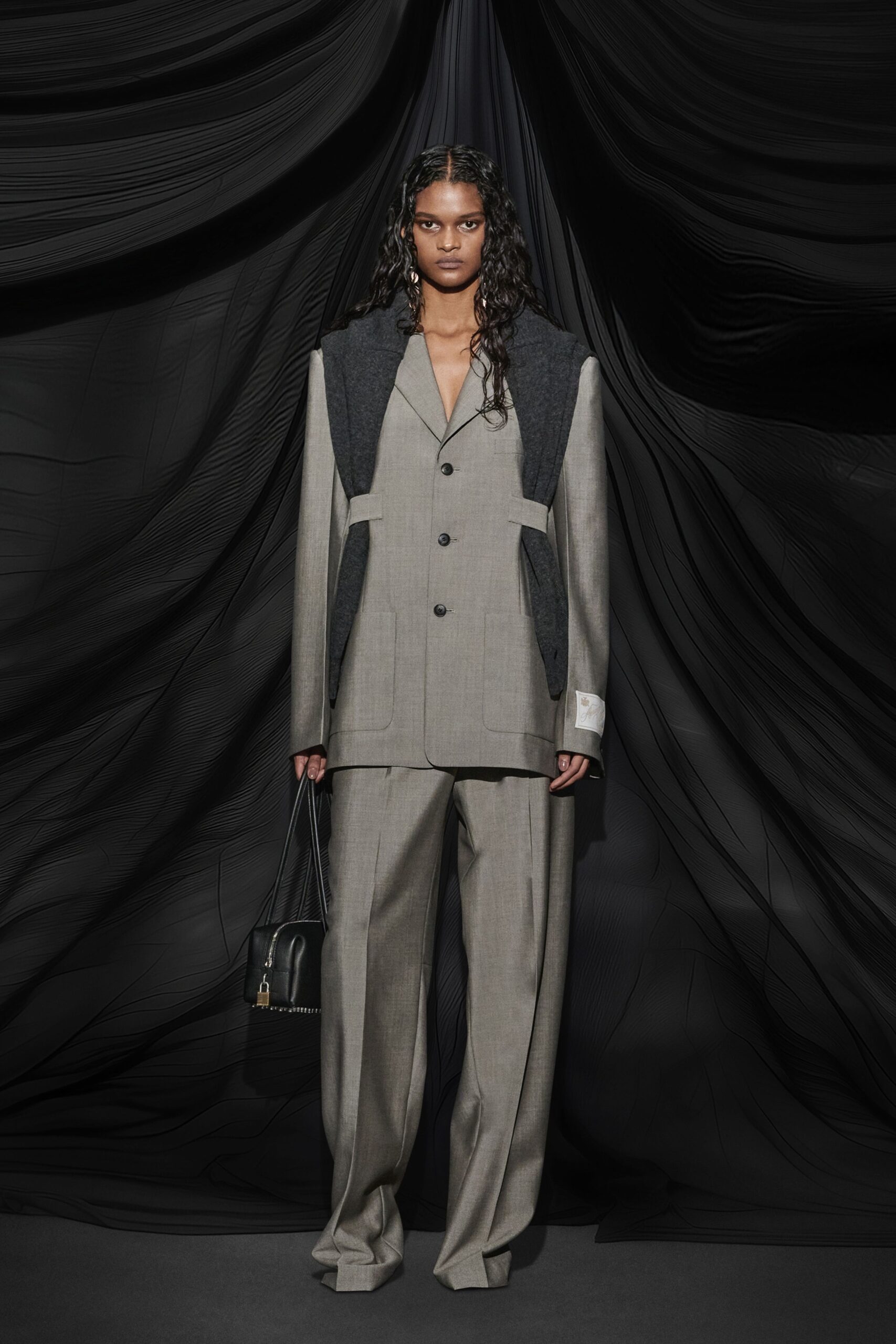 gray tailored suit with bag